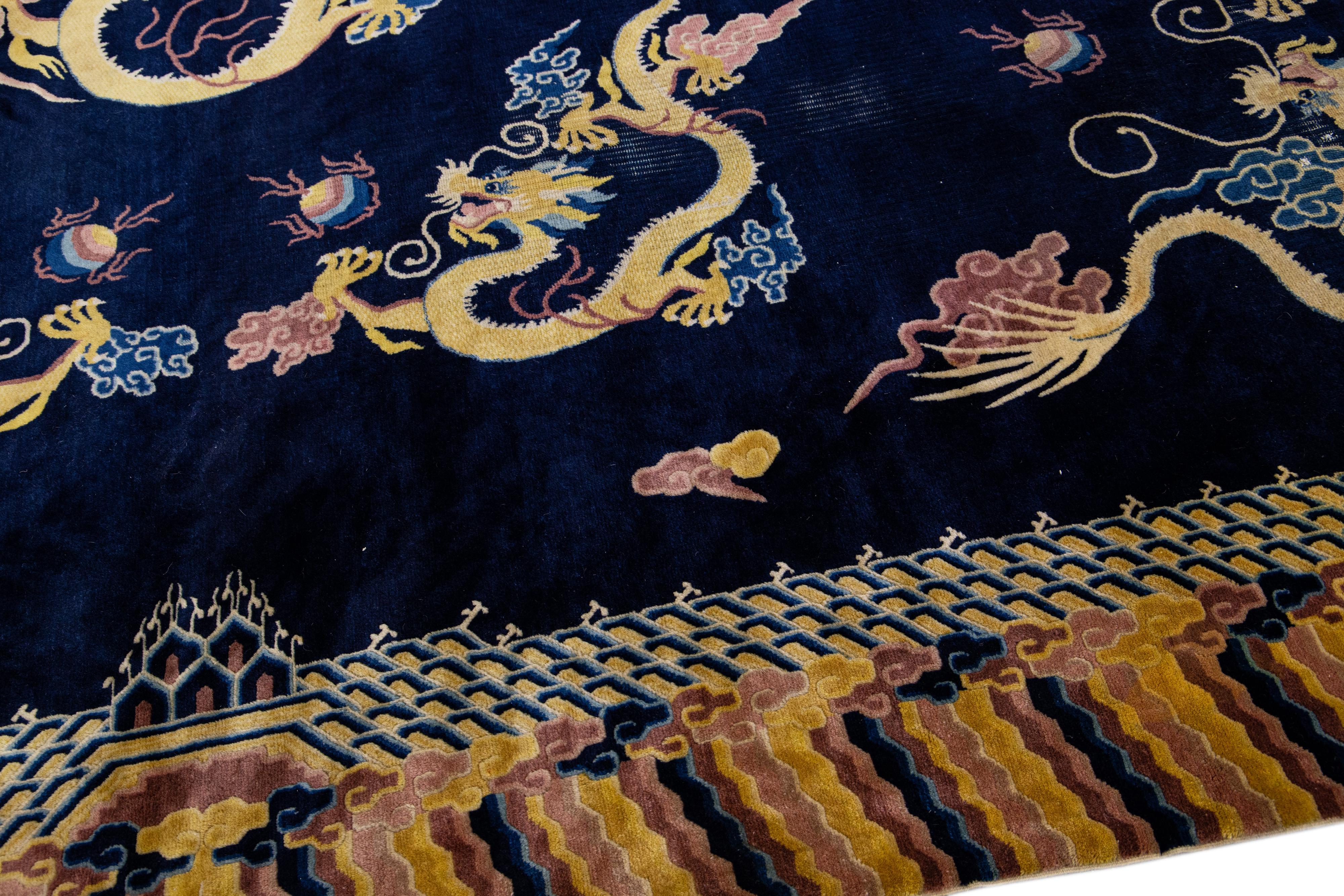 Early 20th Century Vintage Chinese Peking Handmade Dragon Designed Dark Blue Wool Rug For Sale