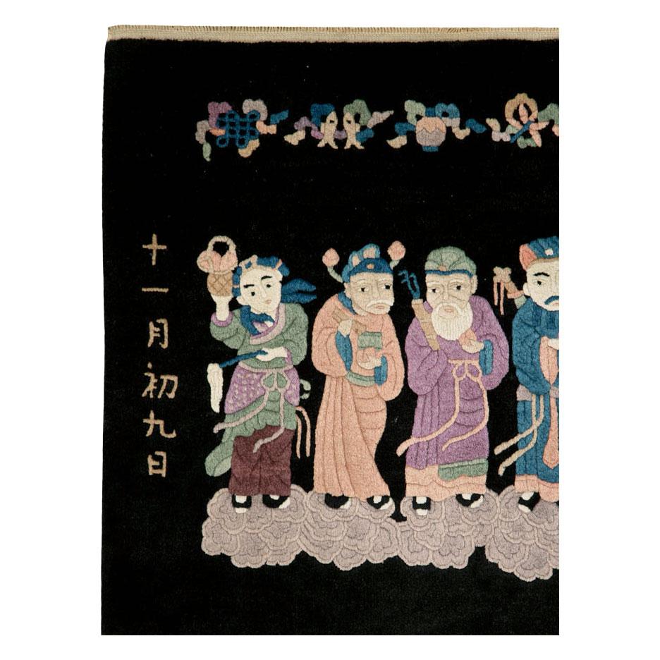 A vintage Chinese Peking carpet from the mid-20th century with a pictorial design.

Measures: 2' 6