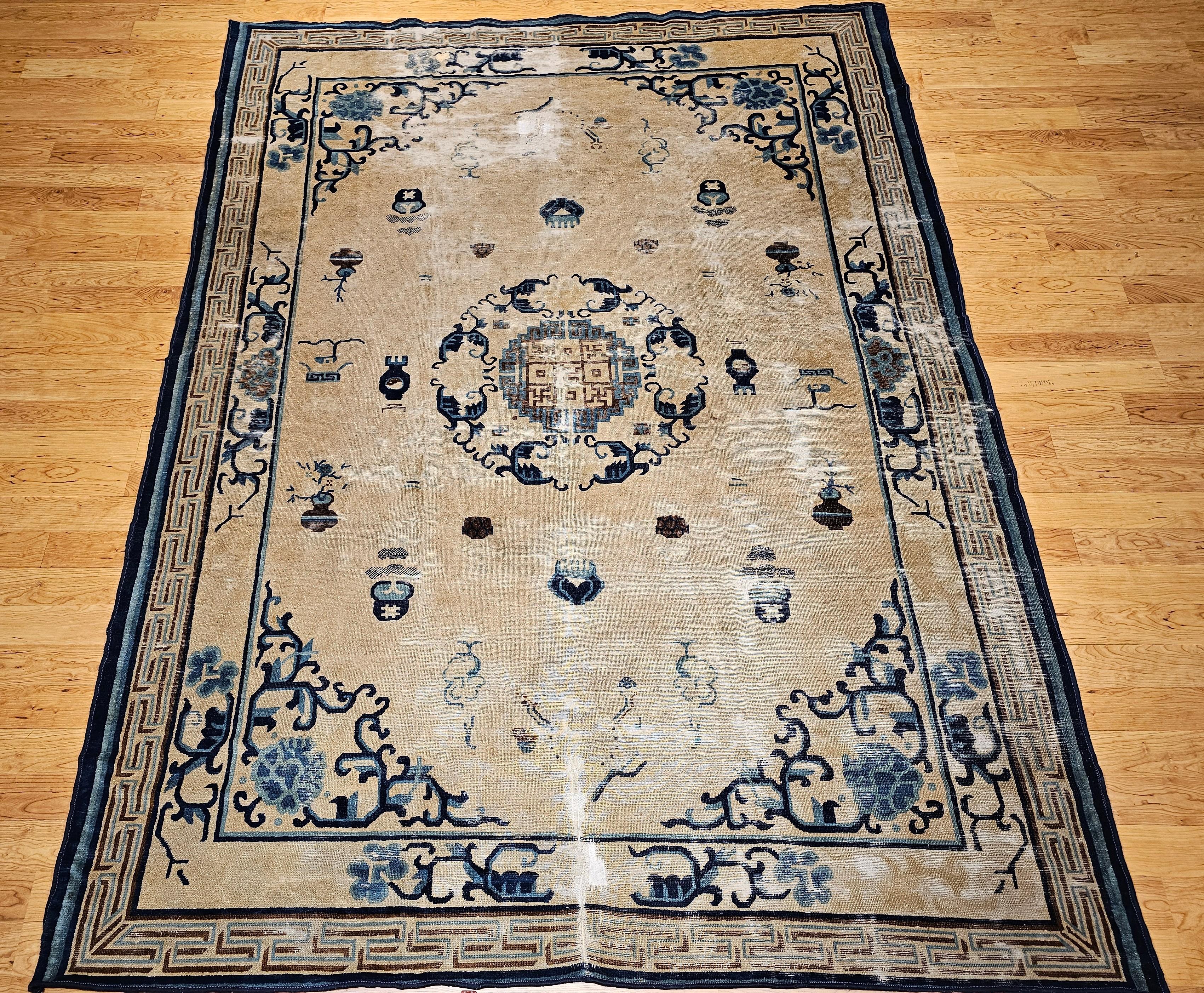 Chinese Peking with Lion Dog and Symbols for Fortune, Prosperity, and Long Life.  A beautiful distressed Chinese Peking room size rug from the 4th quarter of the 1800s. The rug has a very unique and beautiful gray field color with an open design.