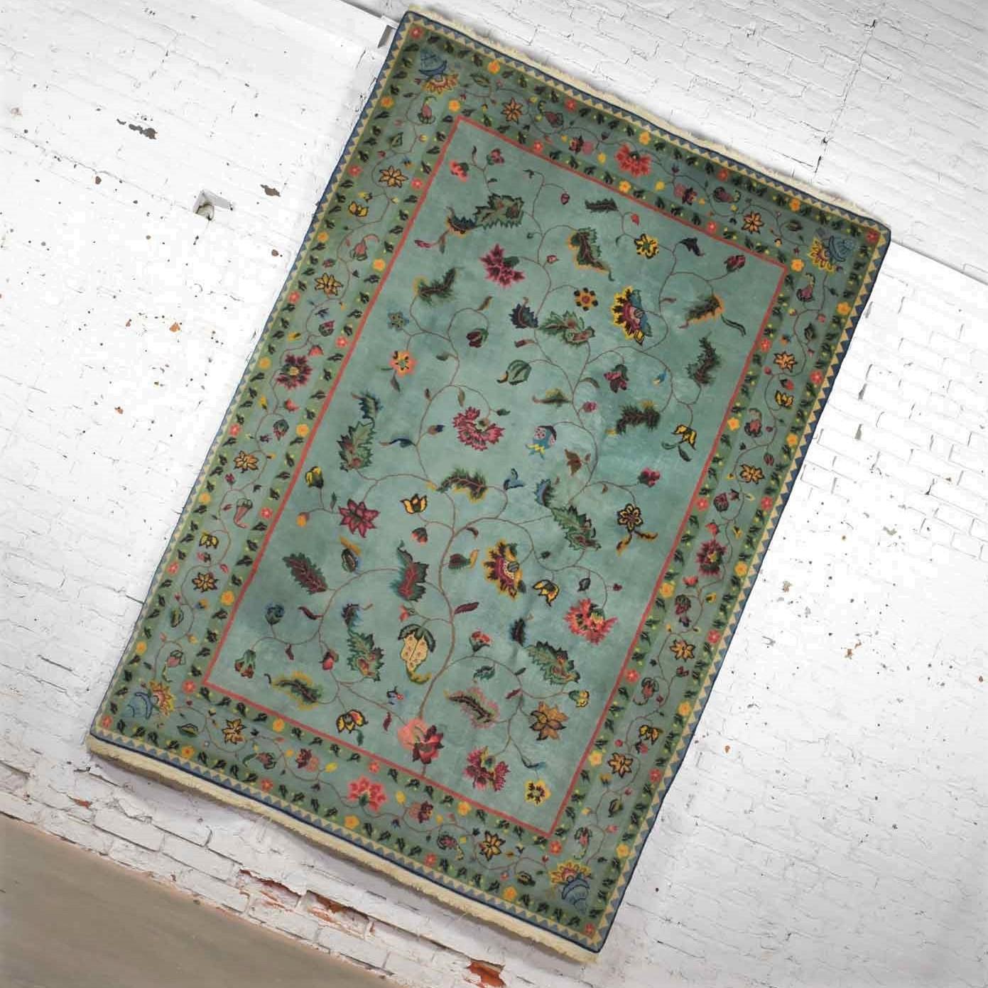 Handsome vintage wool 6’ x 8.9’ handmade Chinese Peking rug in a gorgeous soft teal green with border design and overall center pattern it is in fabulous vintage condition. We have cleaned the rug thoroughly but there may still be small stains but