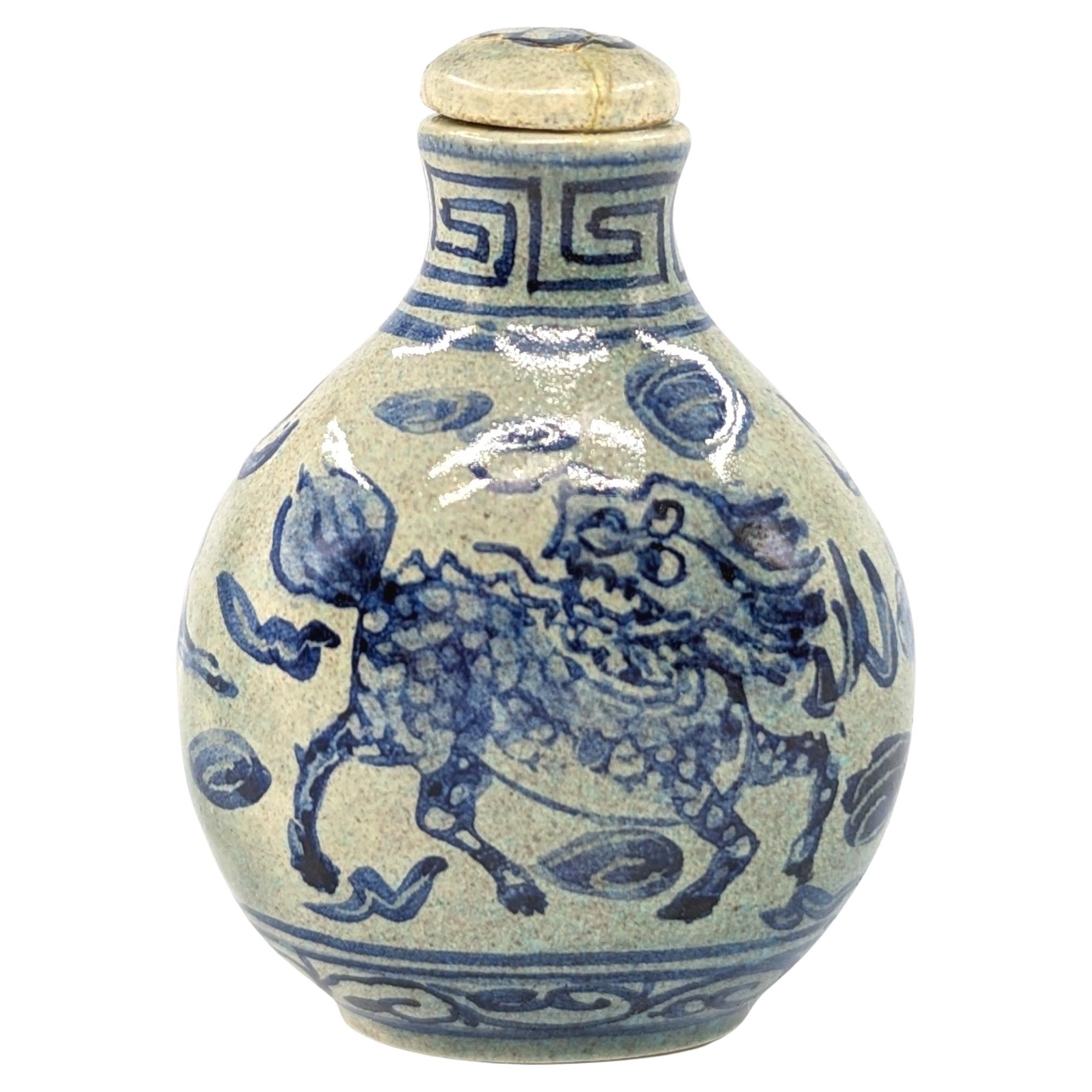 A vintage Chinese porcelain snuff bottle in compressed globular form, hand painted in underglaze blue with a Qilin beast to each side, and four characters Daoguang mark to base within the slightly raised footring

circa: early 20th Century, ROC
