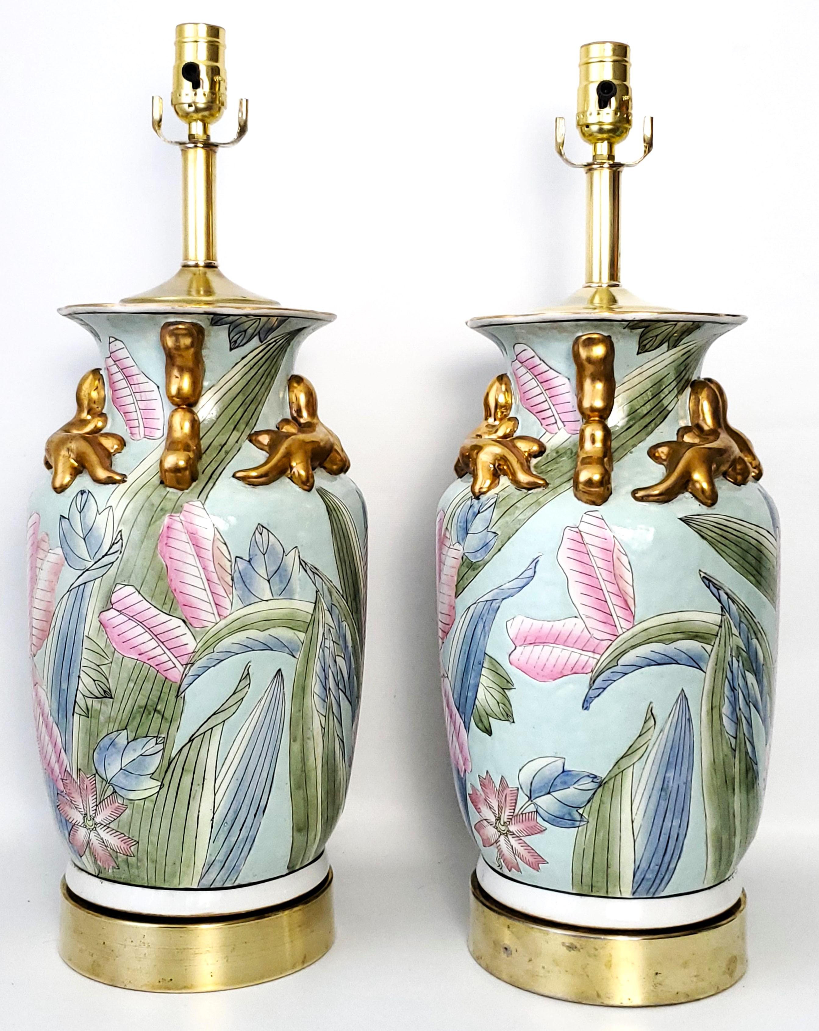 Offering a pair of vintage Chinese porcelain pastel tobacco leaf table lamps with three-dimensional gold salamanders and heavily textured glaze, circa Mid-20th Century. Because these lamps are individually hand painted, they are slightly different