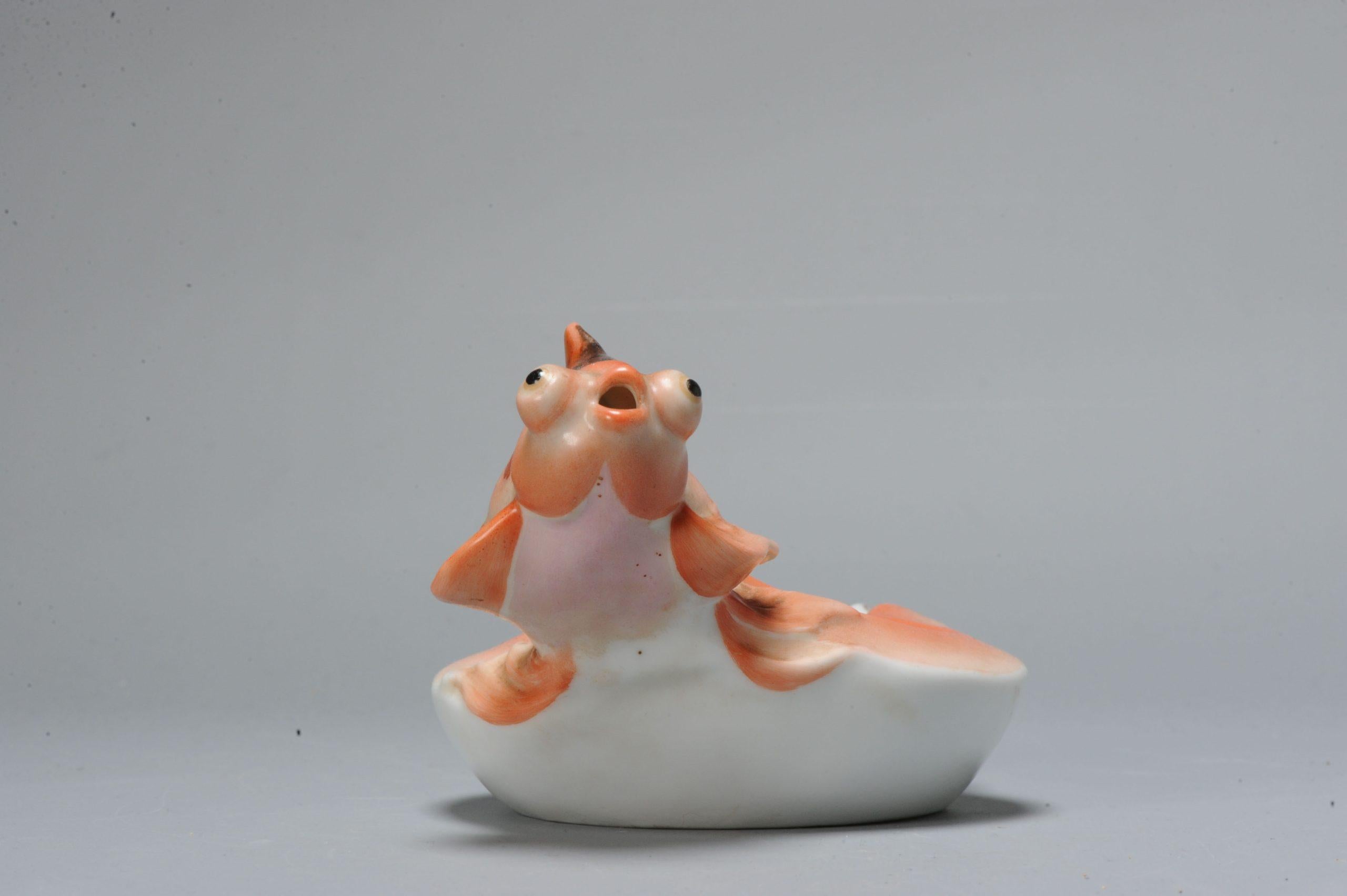 Lovely Chinese porcelain water dropper fish. Dating to the 1980's or 90's.

Additional information:
Material: Porcelain & Pottery
Type: Vase
Region of Origin: China
Period: 20th century PRoC (1949 - now)
Condition: Perfect
Dimension: Ø 16 x 9 H cm