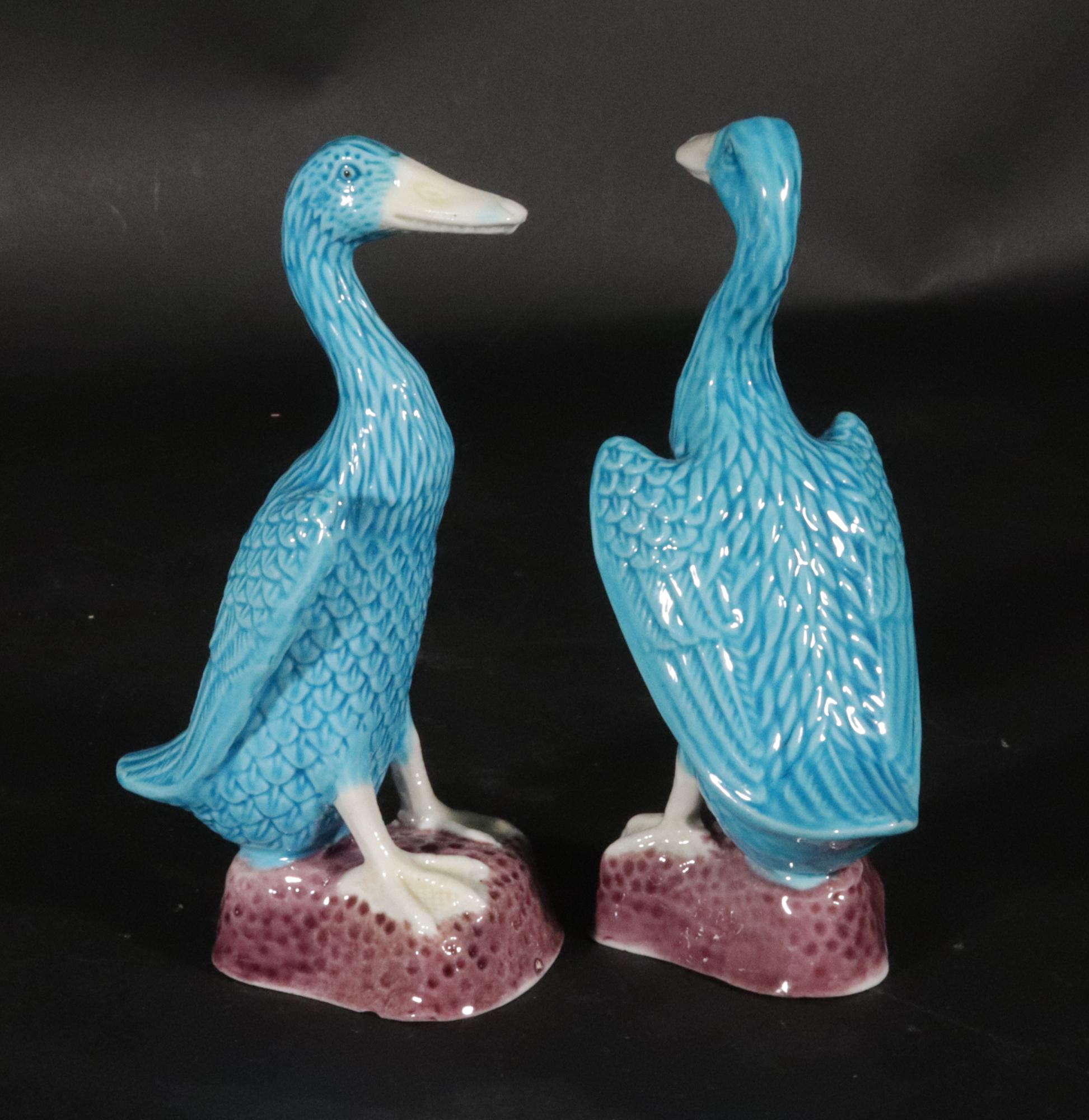 Vintage Chinese Porcelain Turquoise Pair of Ducks,
20th Century

A pair of figures of an Indian runner duck, also known as a bottle duck, colored turquoise with a purple glazed hollow base. 

Dimensions: 4 1/2 inches high x 2 1/2 inches wide x 1 3/4
