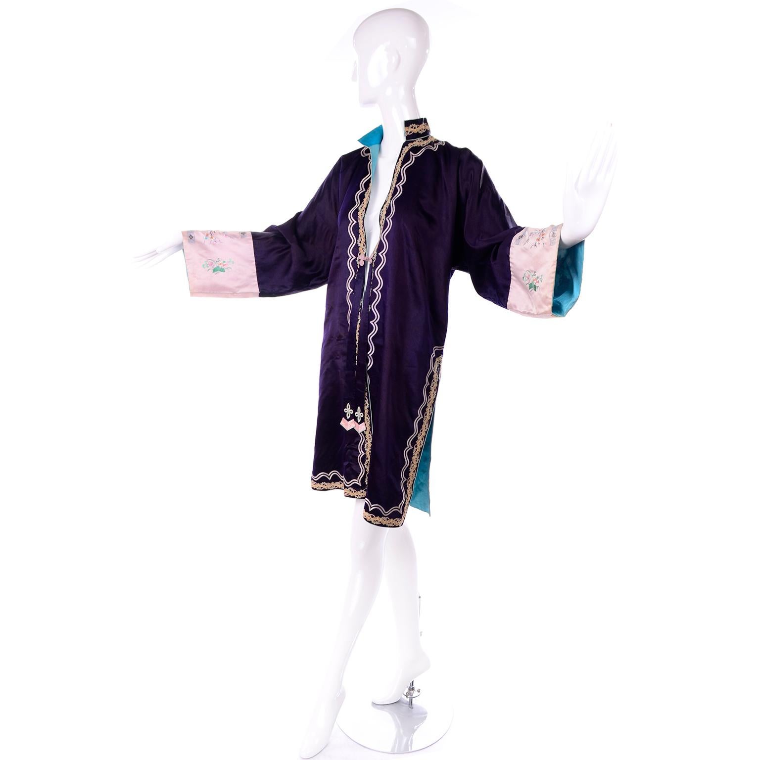 This is a lovely vintage purple silk Chinese jacket with beautiful ribbon & soutache trim with exquisite embroidery. The jacket has center single silk knot closure and lovely aqua blue lining. There are two panels of fabric that start near the