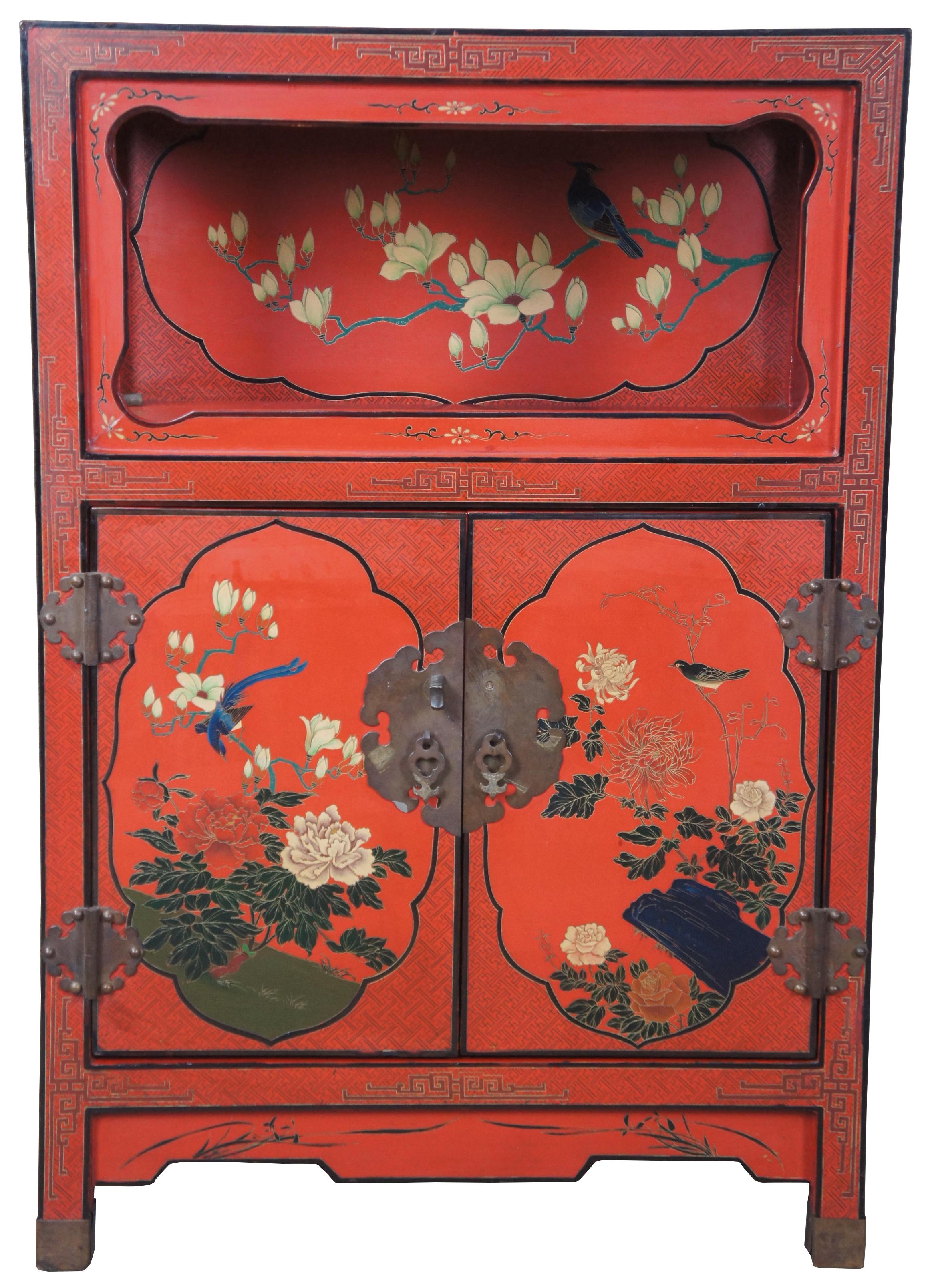 Late 20th century Chinese red lacquer entryway cabinet or stand. Features a beautiful oriental motif showing birds and various flowers. Features a unique open shelf over cabinet.
        