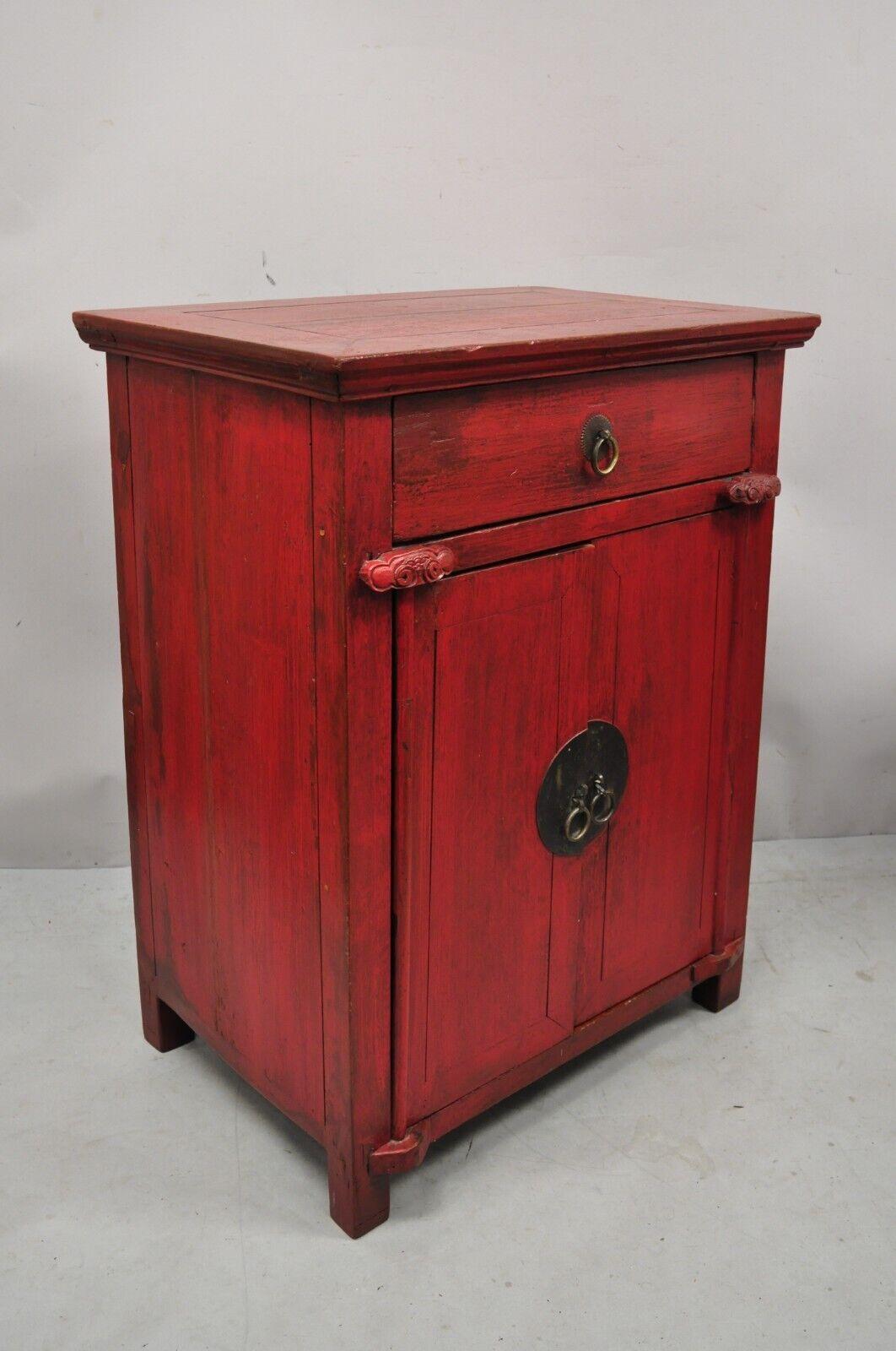 Vintage Chinese red lacquered cabinet cupboard with drawer and swing doors. Item features solid wood construction, red painted distressed finish, 2 swing doors, 1 dovetailed drawer, very nice vintage item, great style and form. Item features late