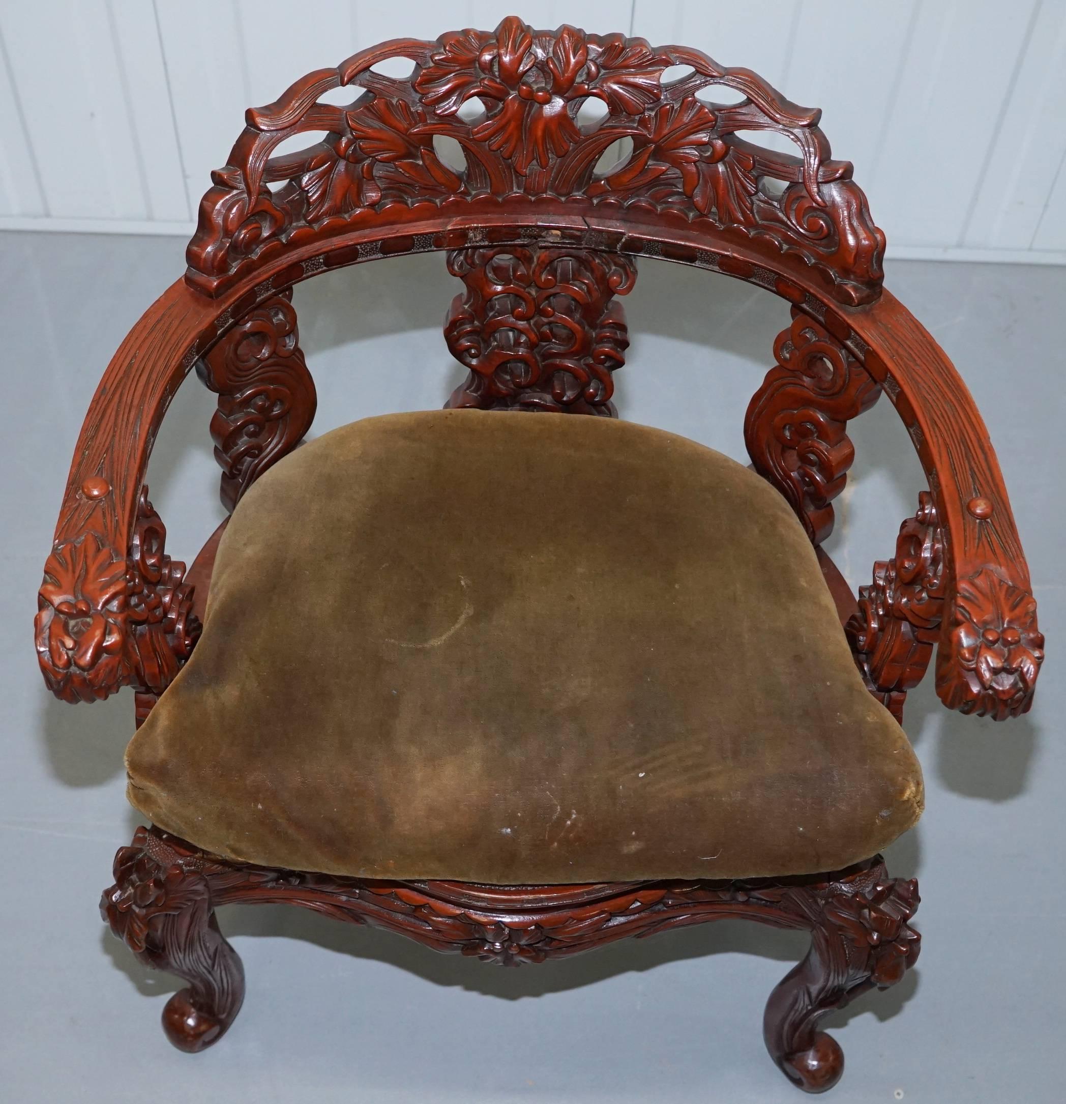 Hand-Carved Vintage Chinese Red Lacquered Carved Elm Armchair with Heavy Foliage Detailing For Sale