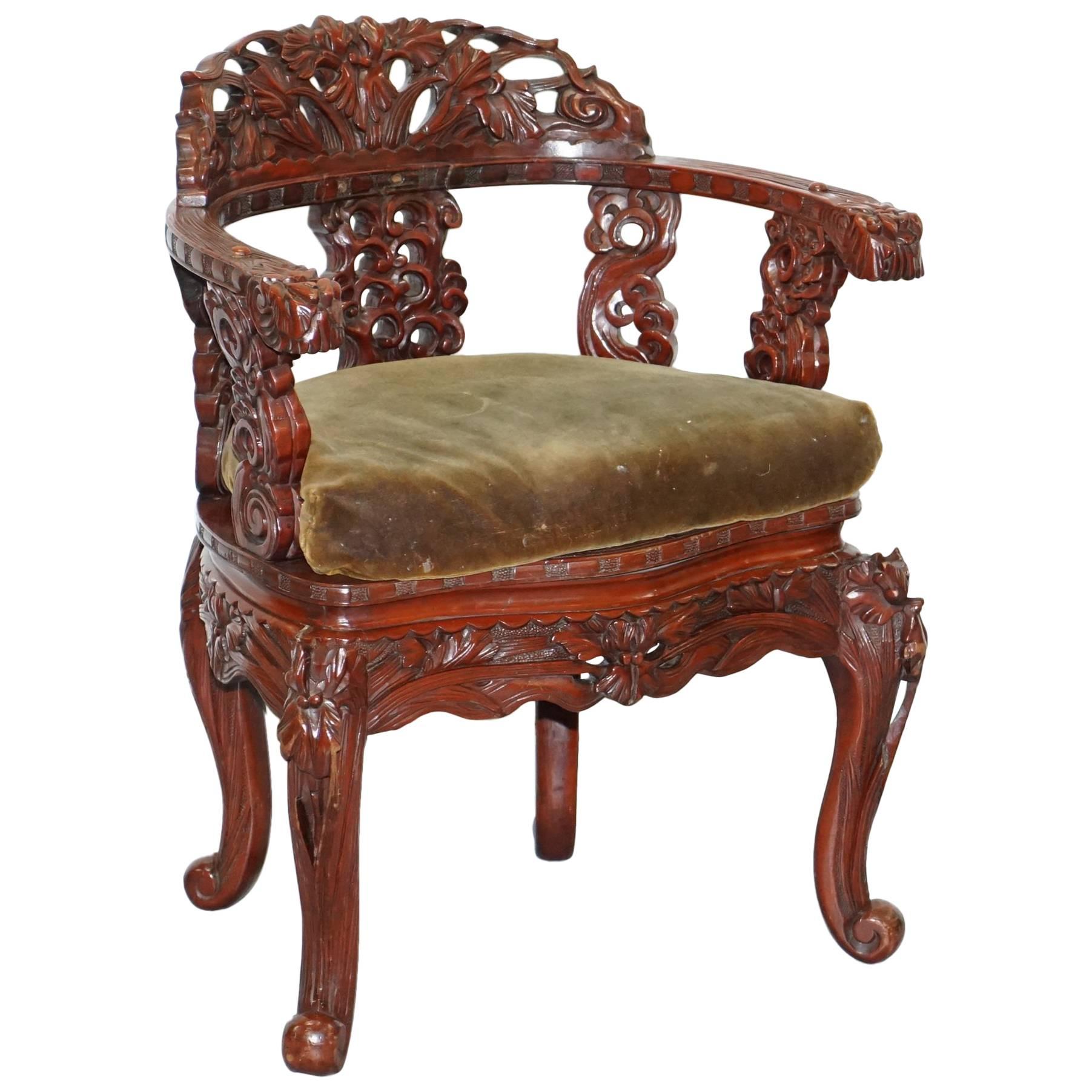 Vintage Chinese Red Lacquered Carved Elm Armchair with Heavy Foliage Detailing For Sale