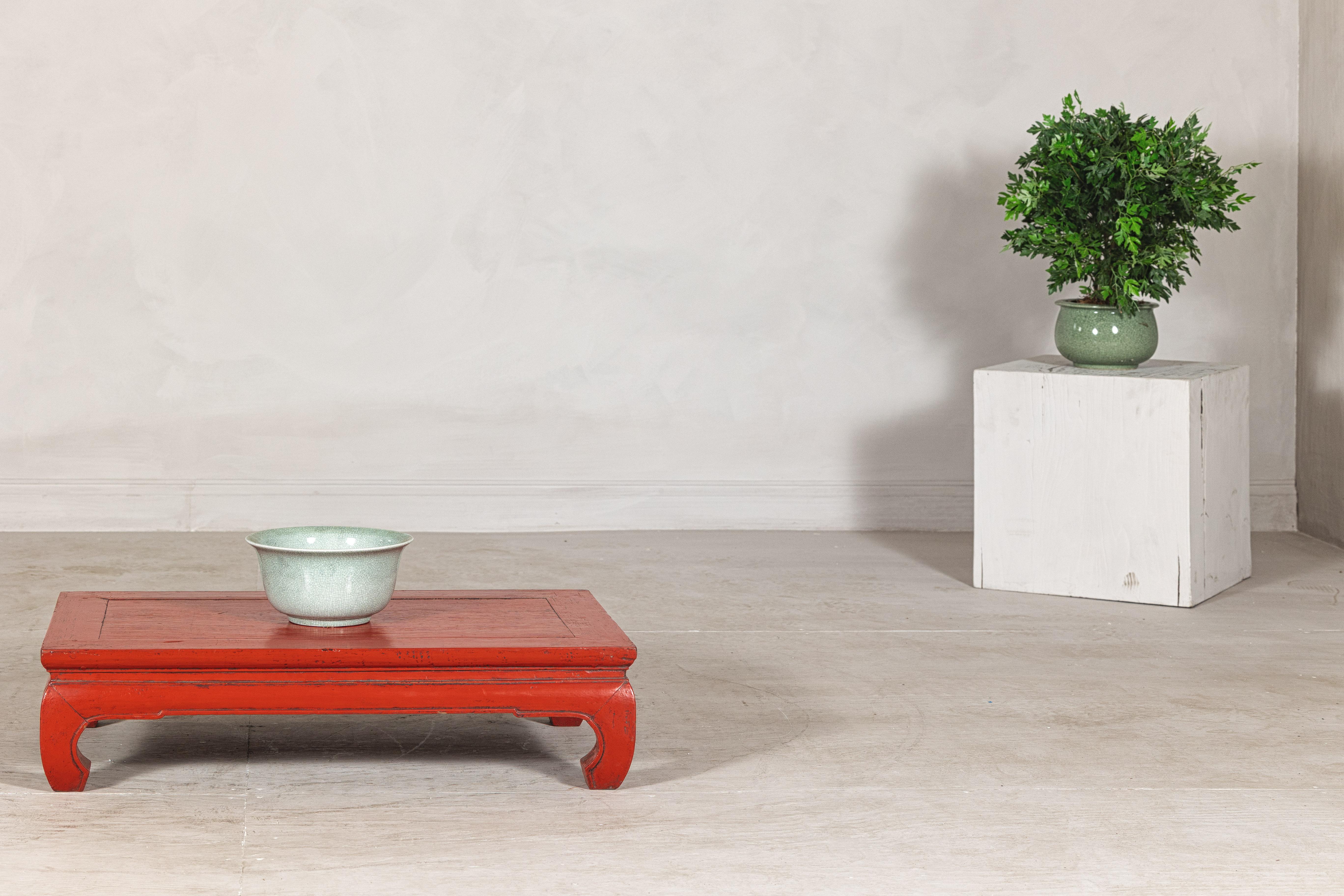 This vintage Chinese kang table, with its distinctly low and graceful profile, brings an authentic sense of historical charm to modern interiors. Crafted in China, the table showcases traditional woodworking techniques, featuring a rectangular