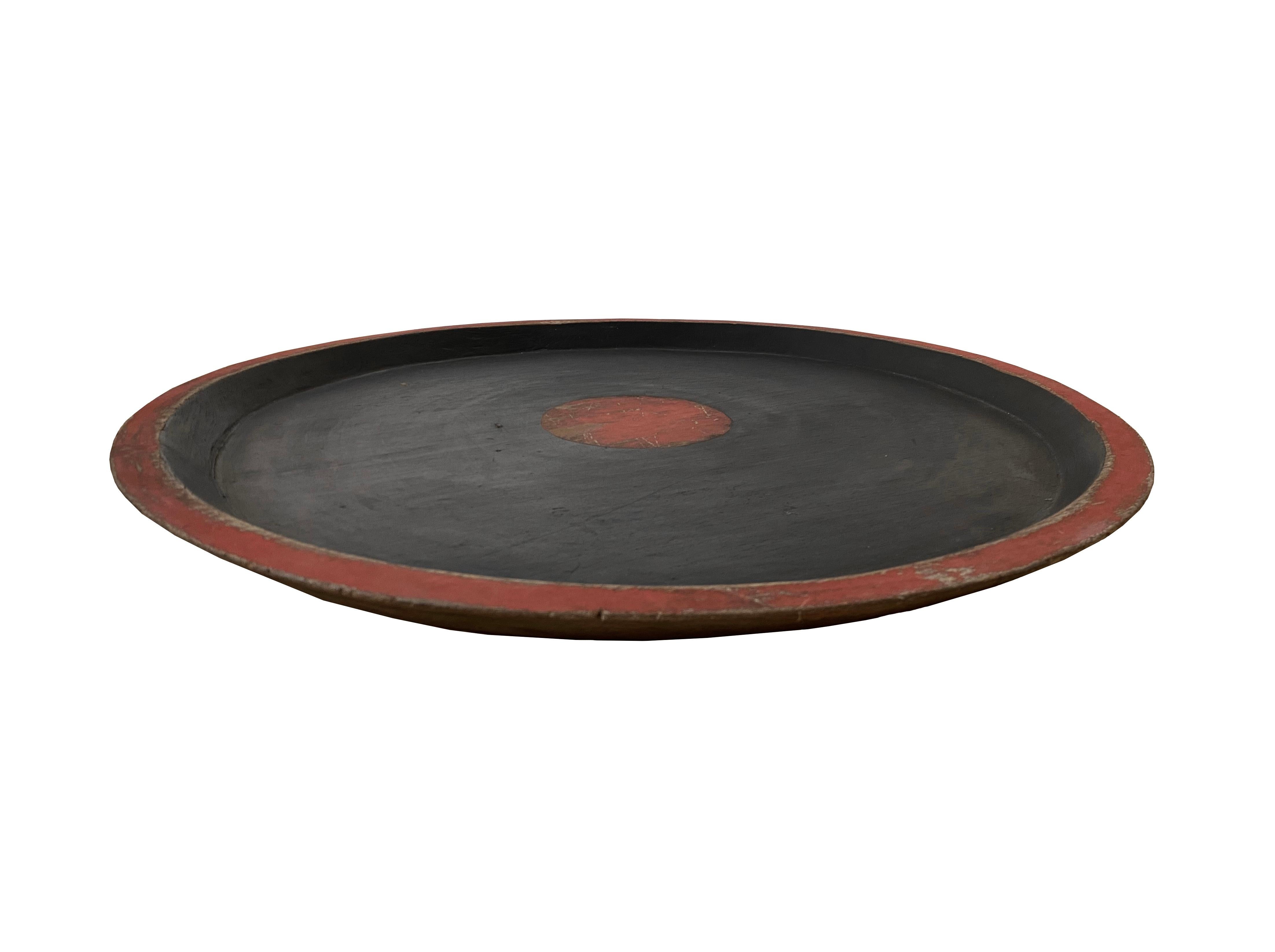 This hand-made vintage Chinese shallow tray features a red center dot and borders. This tray would be a great addition to any space or used as a serving tray.

Dimensions: Diameter 60cm x Height 3cm.

 