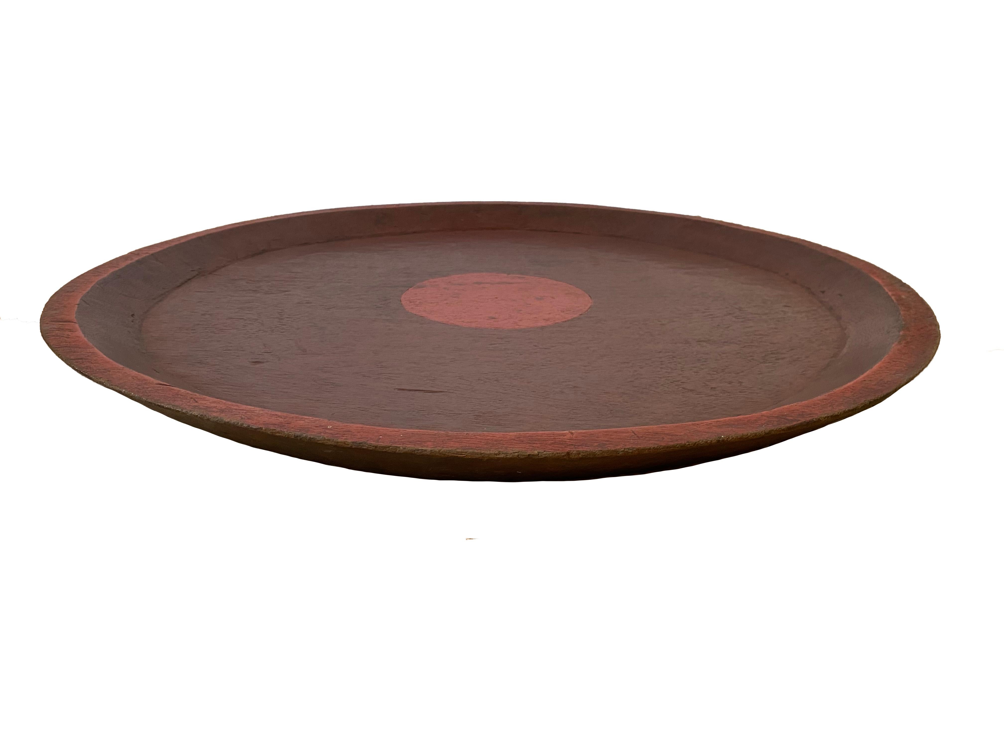 This hand-made vintage Chinese shallow tray features a red center dot and borders. This tray would be a great addition to any space or used as a serving tray.

Dimensions: Diameter 59cm x Height 3.5cm.

 