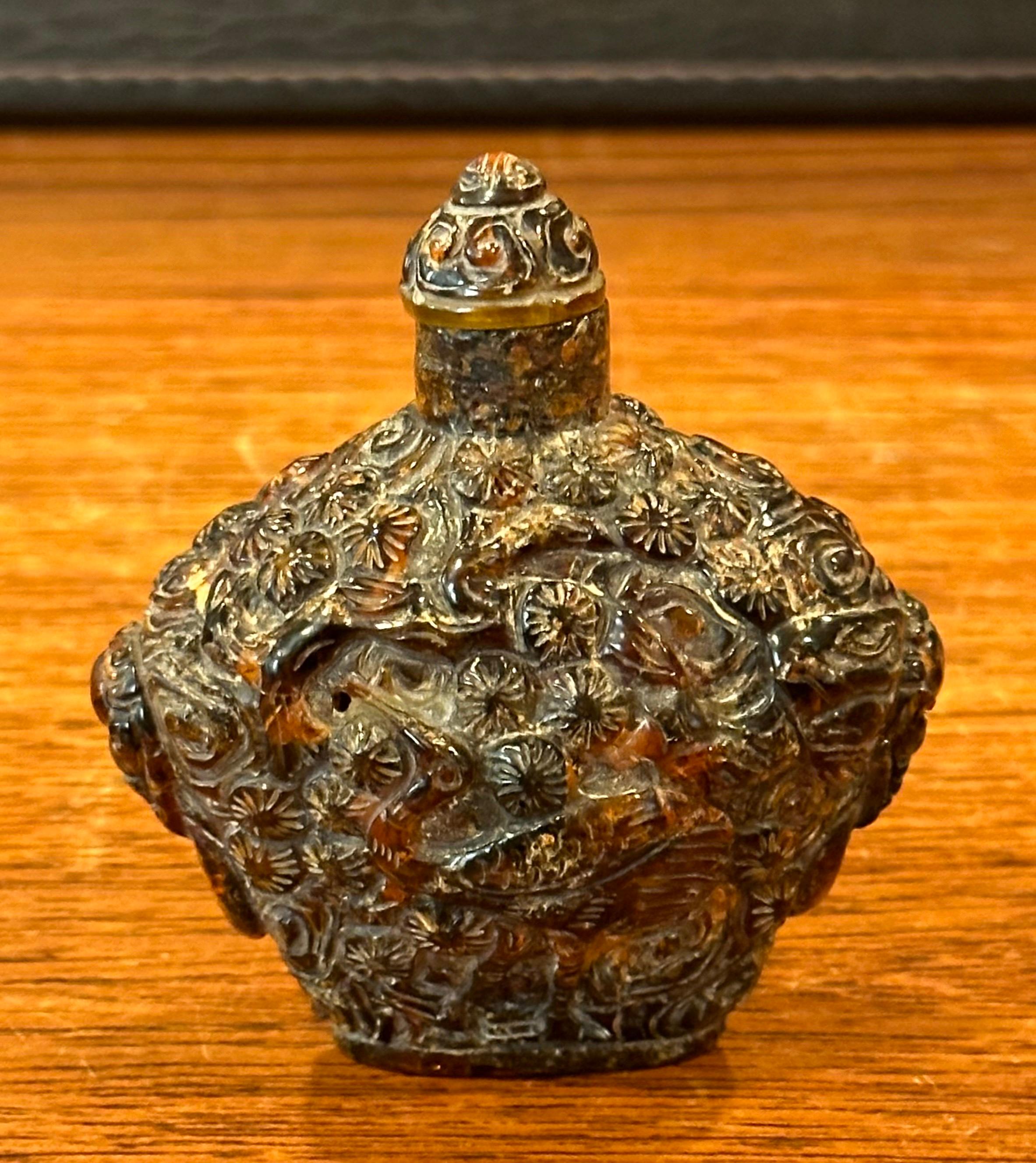 20th Century Vintage Chinese Relief Amber Snuff Bottle For Sale