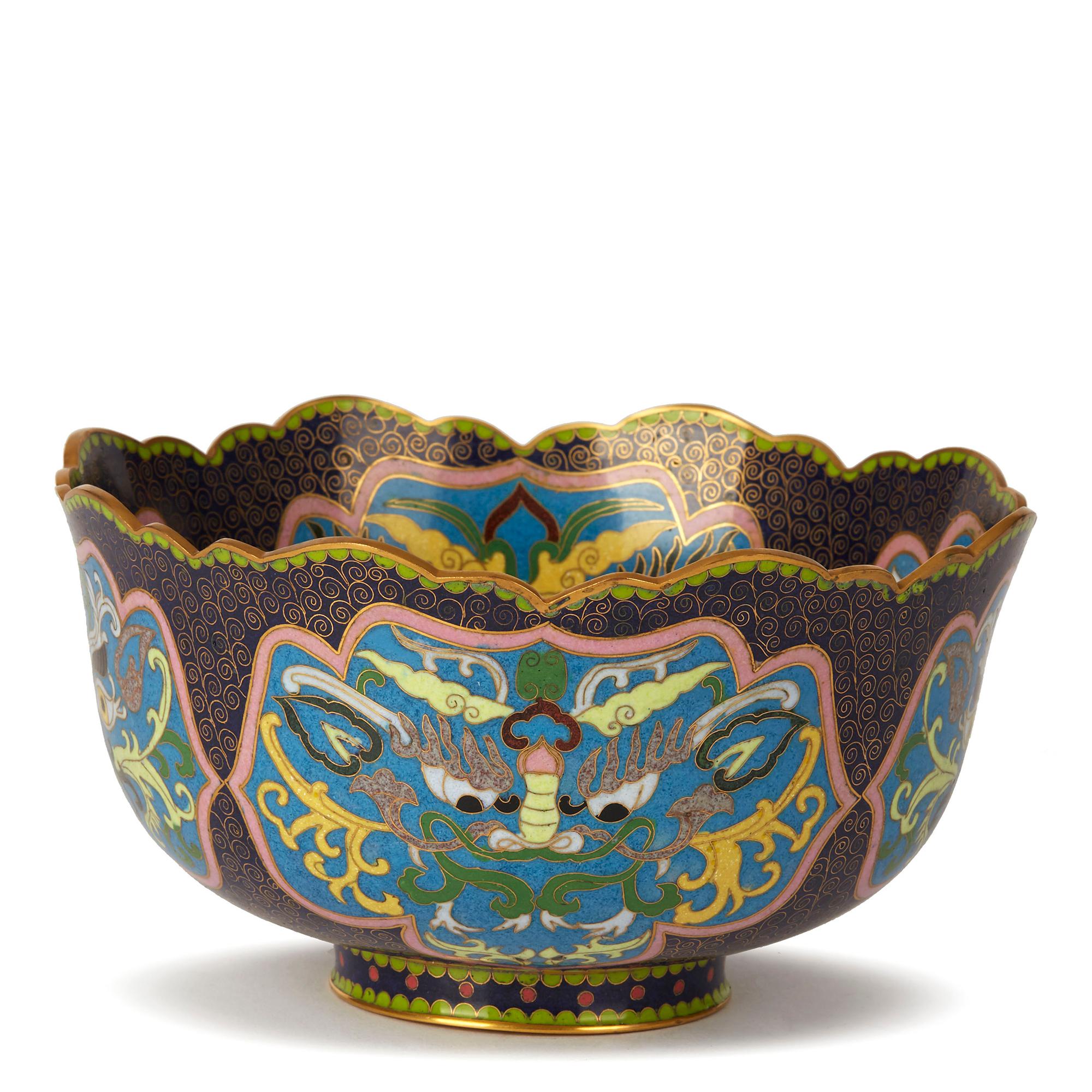 An exceptional and finely decorated vintage Chinese Republic period cloisonné bowl decorated with panels containing grotesque masks. The rounded and heavily made bowl stands on a narrow rounded foot with a shaped rim with a gilded finish to the edge