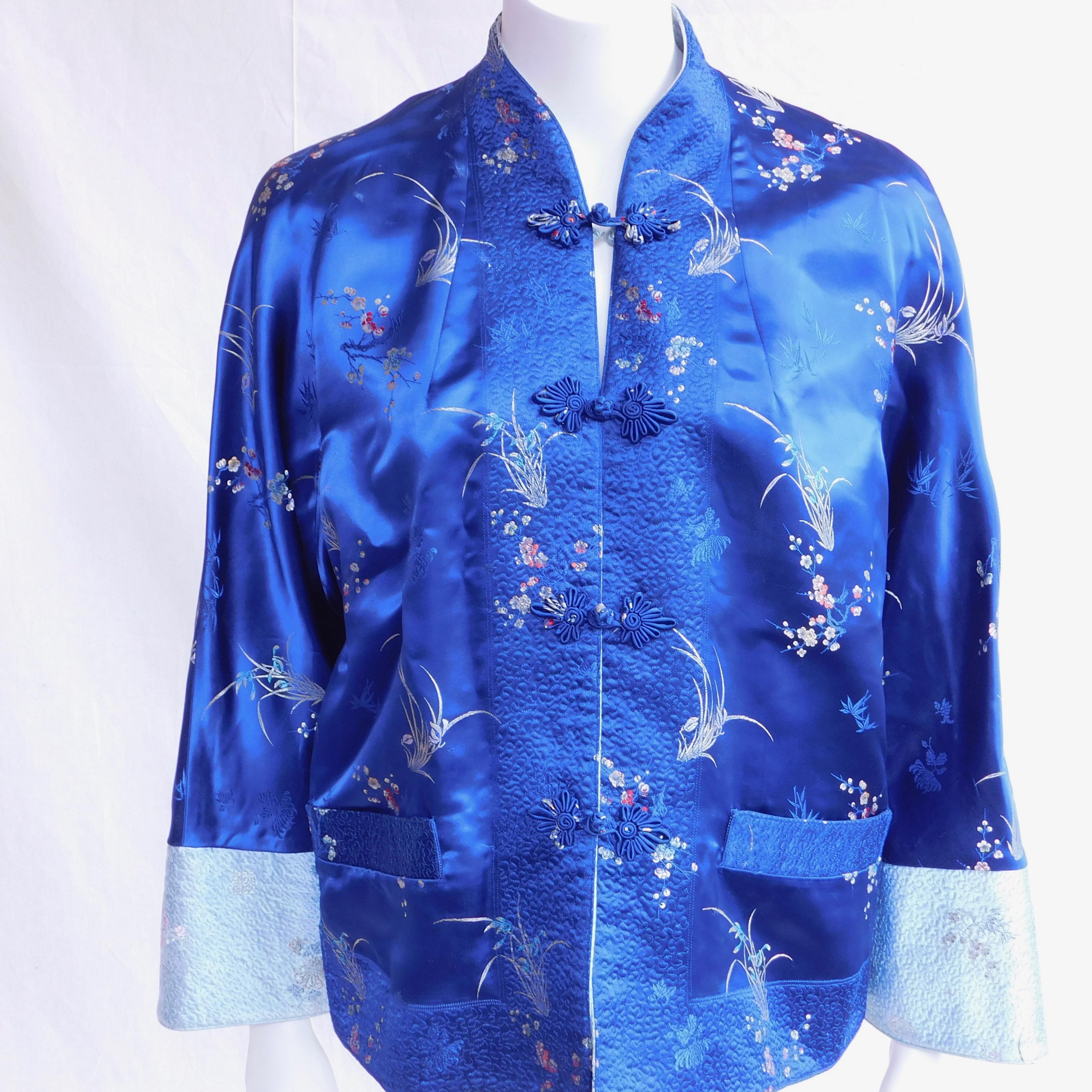 Circa 1970 Chinese Mandarin jacket made to be fully reversible in royal blue silk on one side and light blue silk on the other. Closures are hand tied frog knots. 
Made to be a loose unconstructed fit , waist is 117 cm total width(46