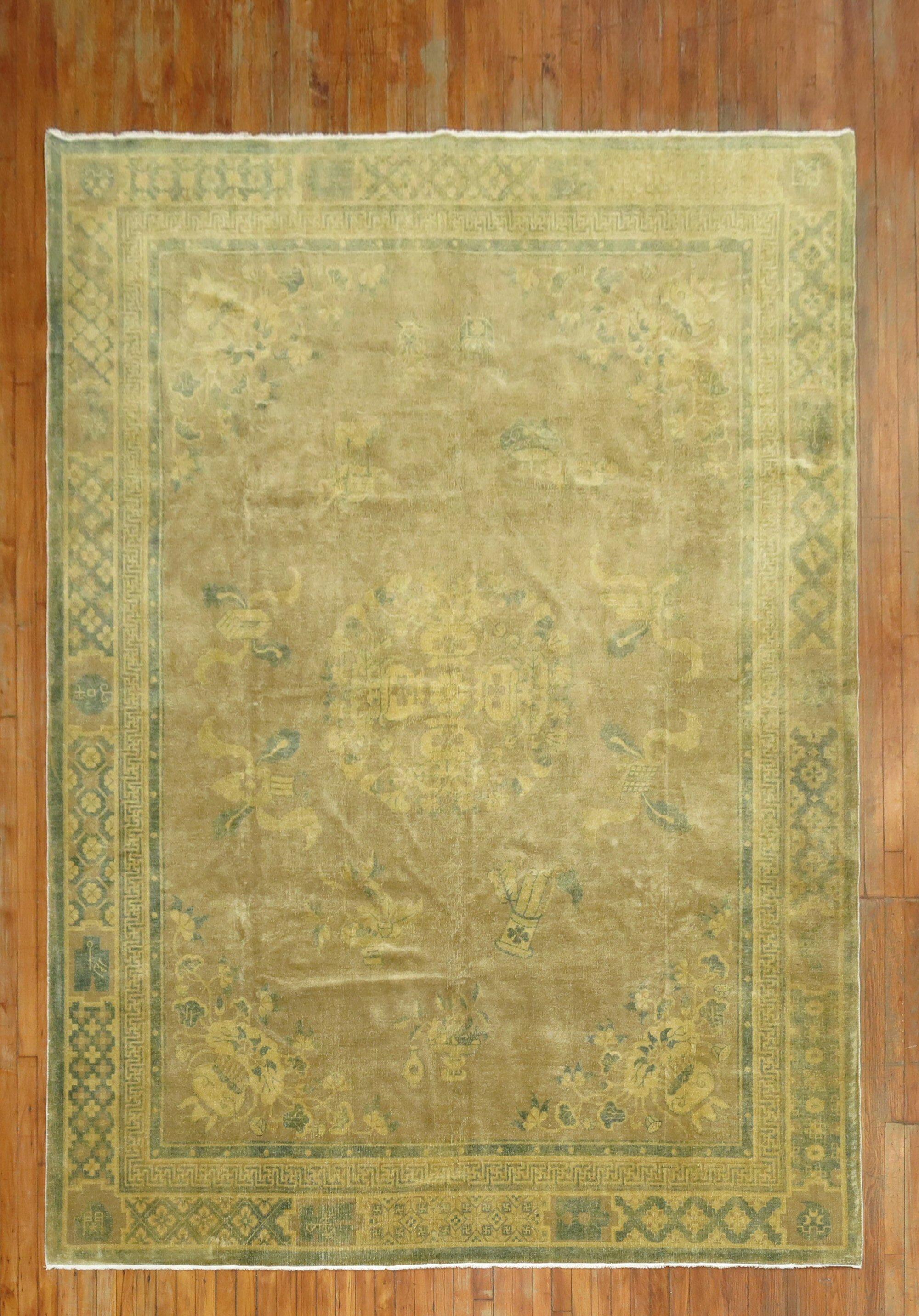 A mid-20th-century room size Chinese rug in soft brown and olive tones

Measures: 7'10'' x 10'9''.