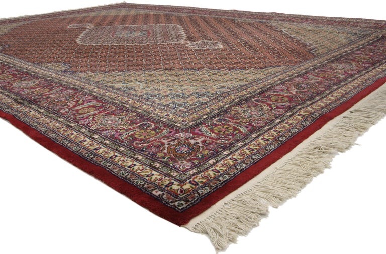 74670 Vintage Chinese rug with Persian Mahi Fish design with Manor House style. This hand knotted wool and silk vintage Chinese rug beautifully showcases a Persian Mahi Fish design in a jewel-tone color palette. A grandeur lozenge and two cartouche