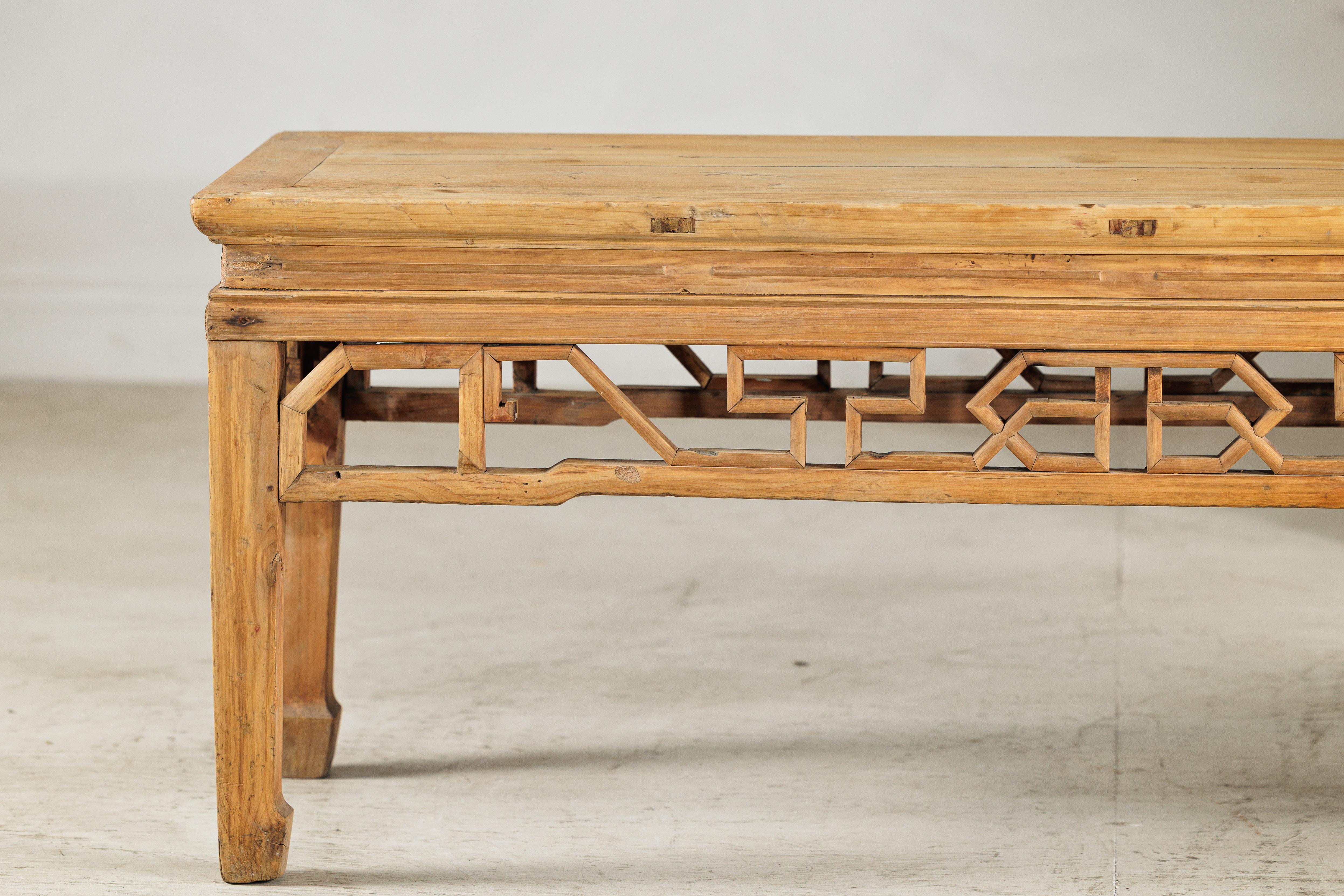 20th Century Vintage Chinese Rustic Low Table with Geometric Carved Fretwork Apron For Sale
