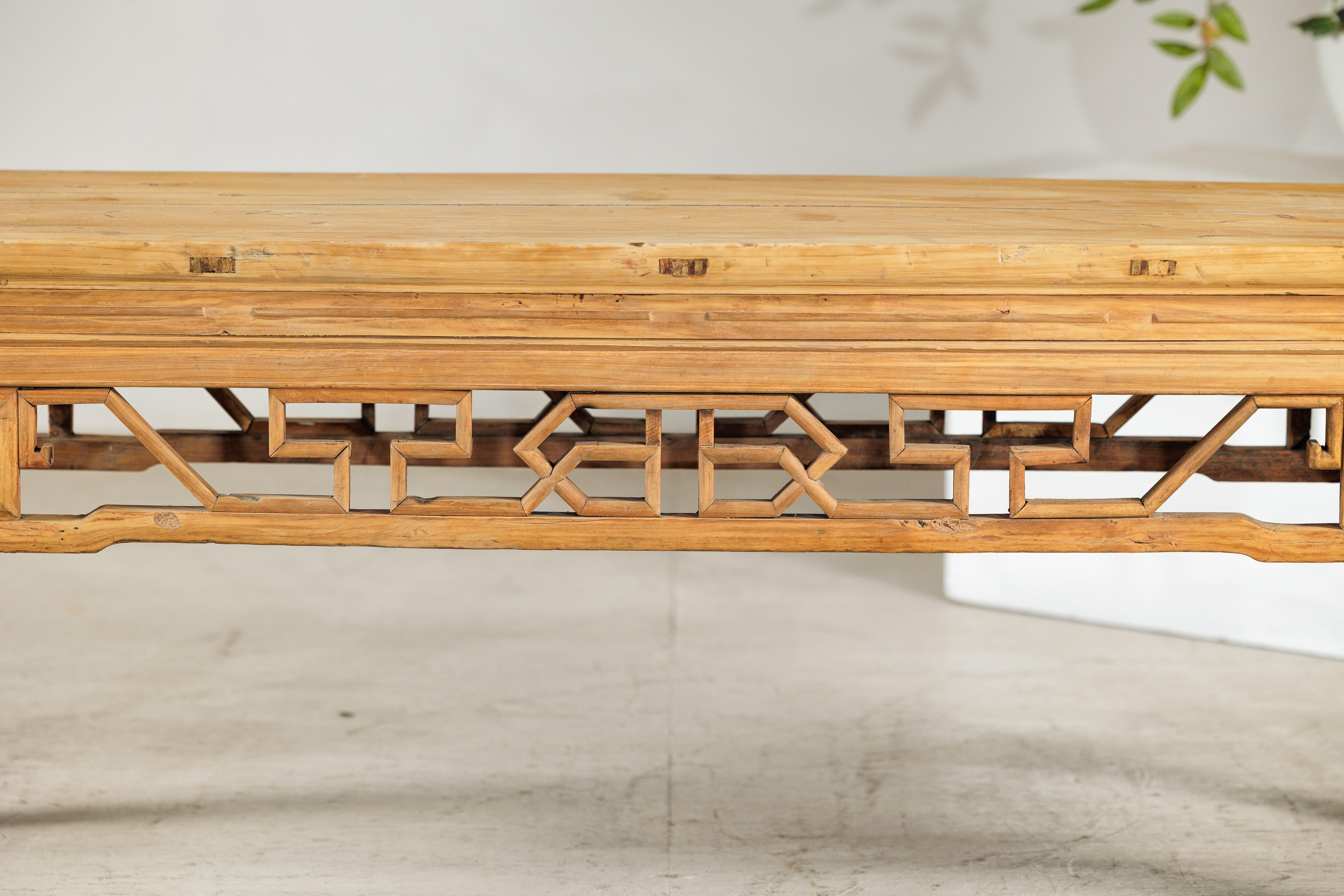 Softwood Vintage Chinese Rustic Low Table with Geometric Carved Fretwork Apron For Sale