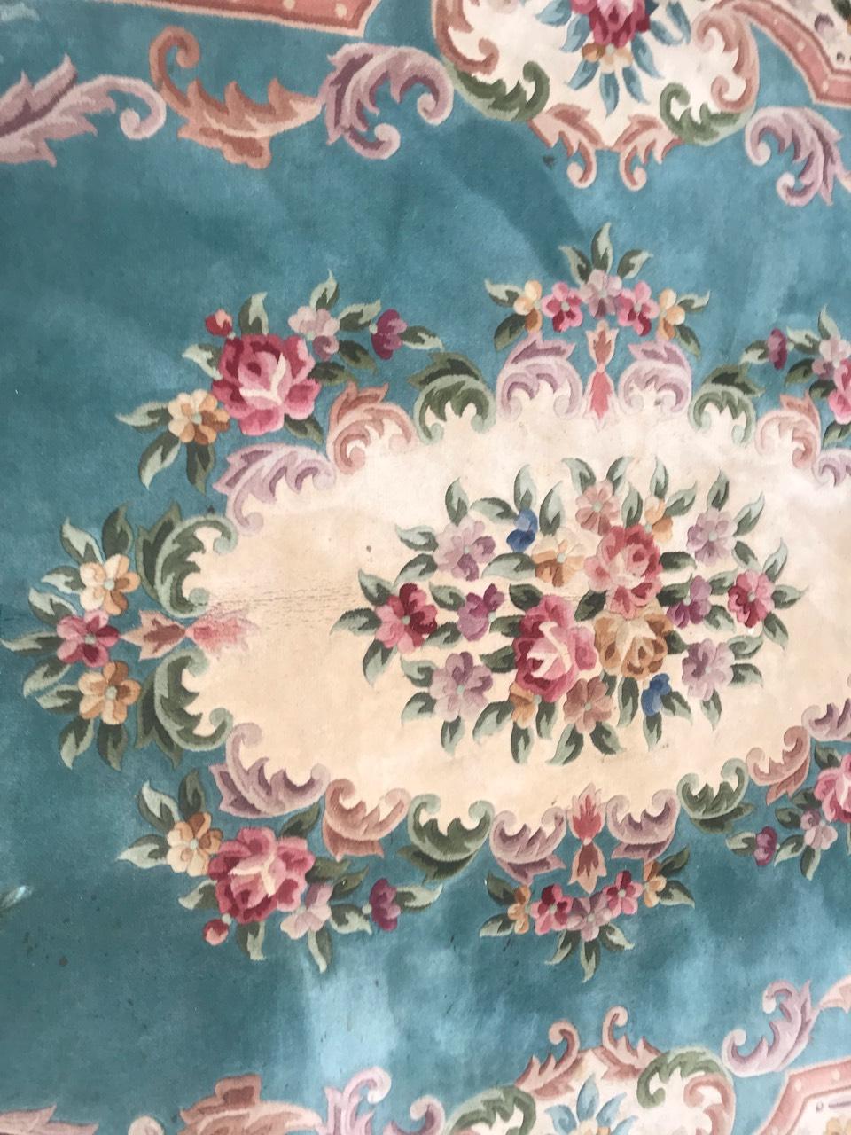 Exquisite late 20th-century Chinese rug featuring an Aubusson or Savonnerie design. This hand-knotted masterpiece showcases a vibrant color palette including blue, pink, and green. The wool velvet on a cotton foundation enhances its luxurious feel.