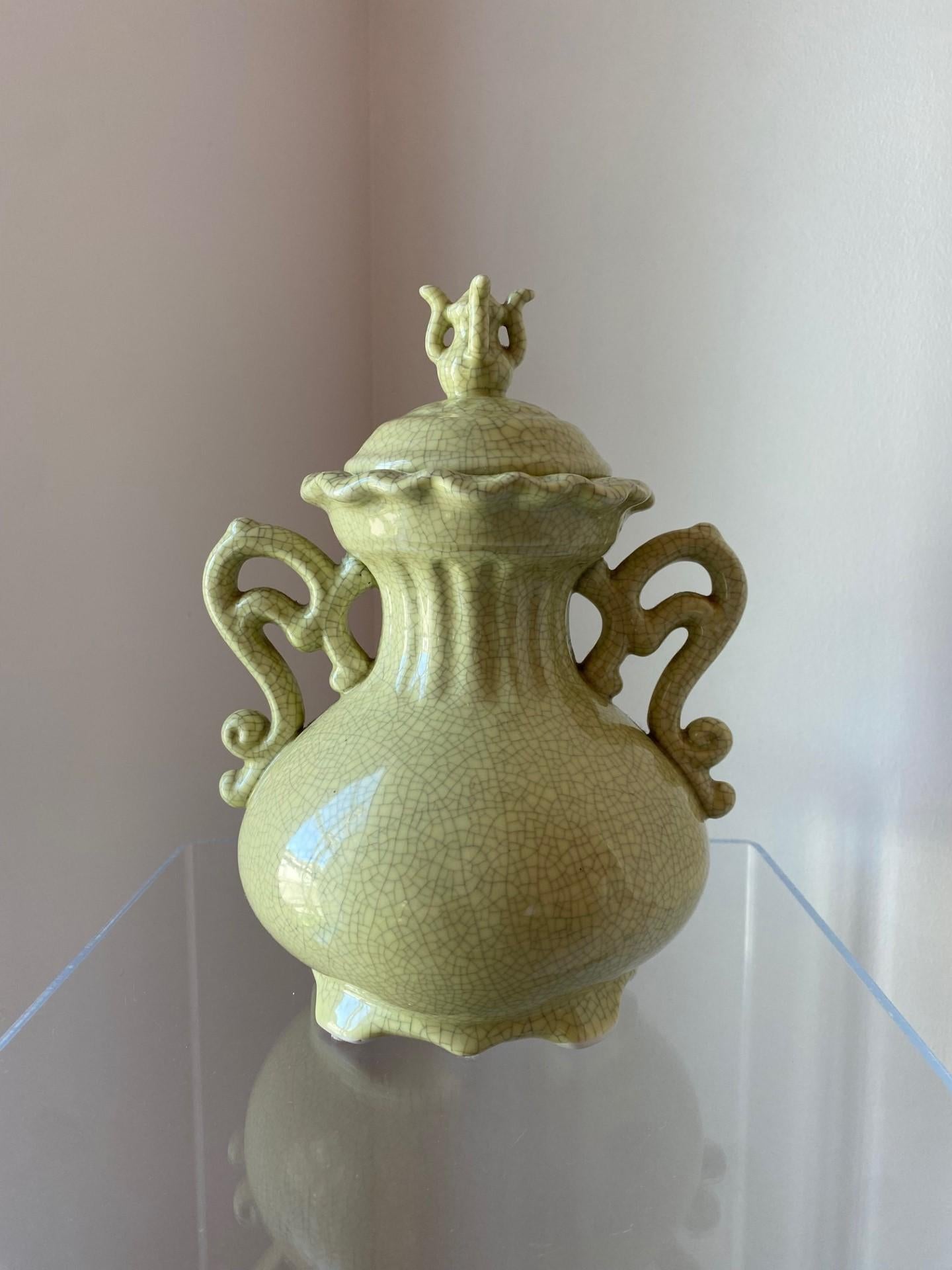 Beautiful vintage piece of ceramic chinoiserie.  This beautiful urn is sculptural as it is versatile.  Traditional chinoiserie profile and lines define this beautiful piece while the glazed crackle finish exudes versatility and beauty.  An