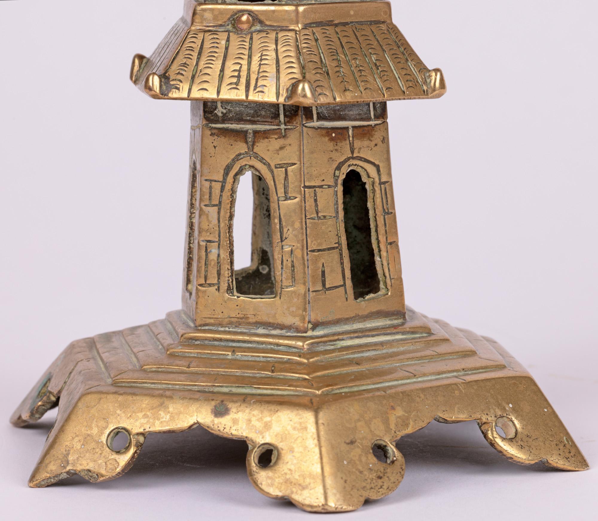 A good quality vintage, possibly antique, Chinese brass seven tier pagoda for incense dating from the early 20th century or earlier. The pagoda stands on a wide hexagonal shaped base raised on six scroll and pierced feet with steps leading up to the