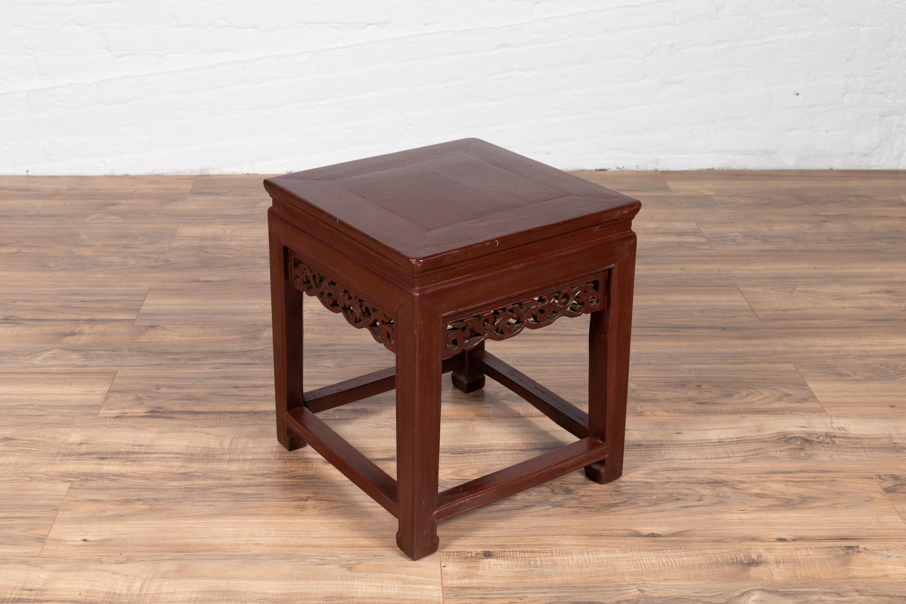 Wood Vintage Chinese Side Table with Dark Red Patina and Foliage Hand Carved Apron For Sale