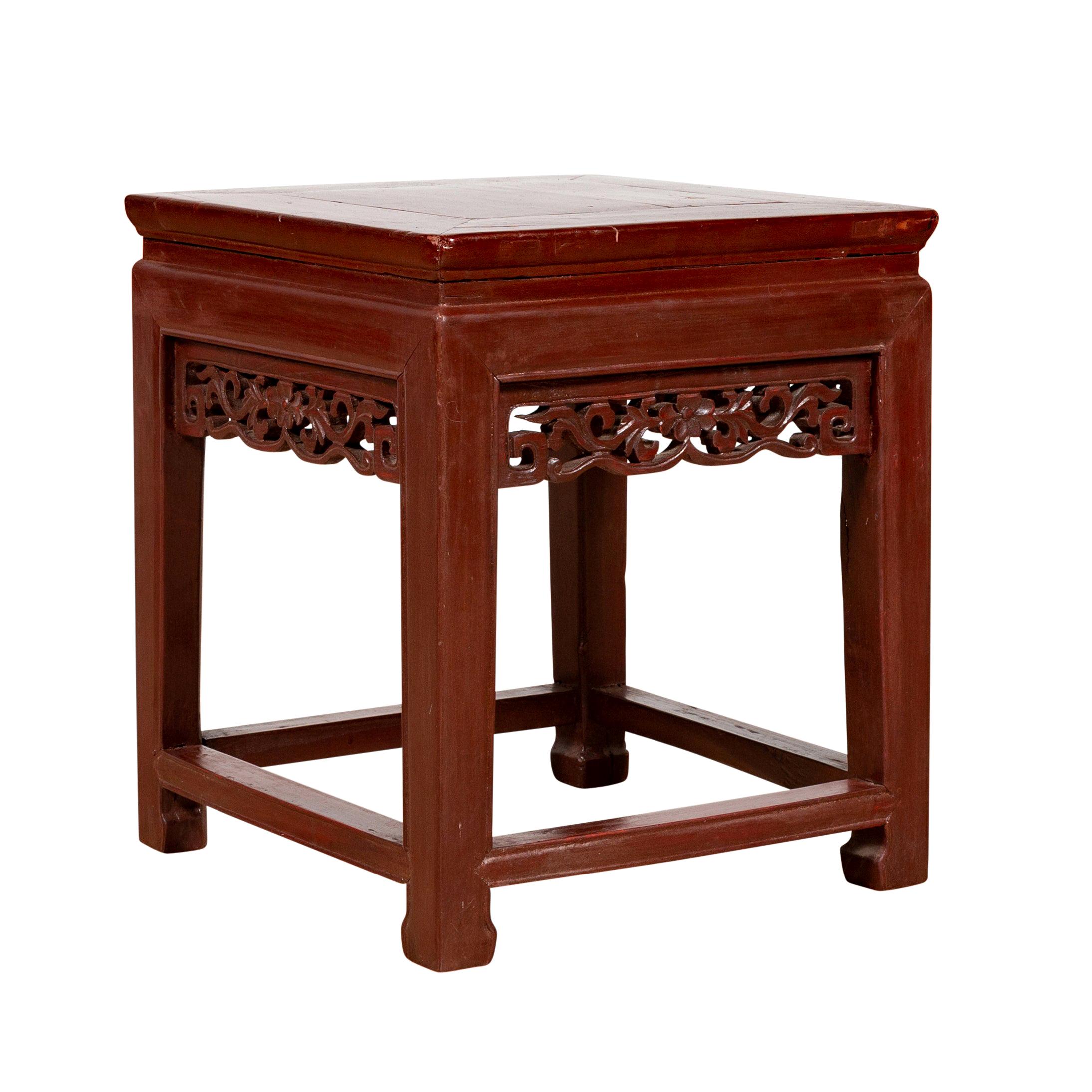 Vintage Chinese Side Table with Dark Red Patina and Foliage Hand Carved Apron For Sale