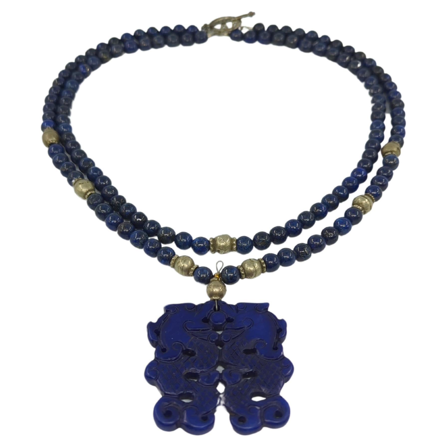 This vintage beaded Lapis necklace is a striking piece of jewelry that exudes both elegance and versatility. Measuring a generous 42 inches in total length, the necklace offers multi-wear options, allowing it to be worn either as a single loop or