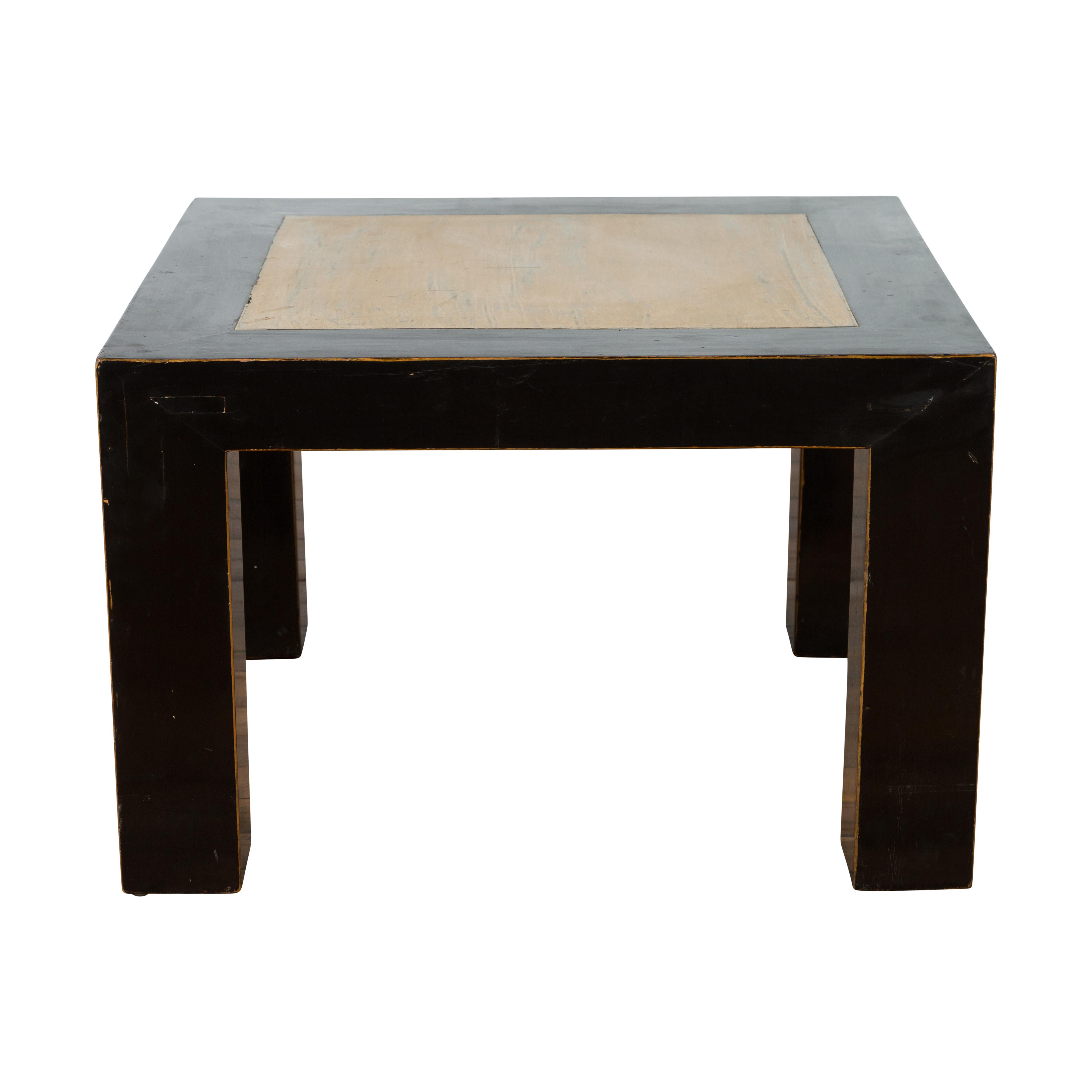 A Chinese vintage square shaped lacquered wood coffee table from the 20th century with antique palace courtyard stone inset and straight legs. Created in China during the 20th century, this square shaped coffee or drinks table features a linear