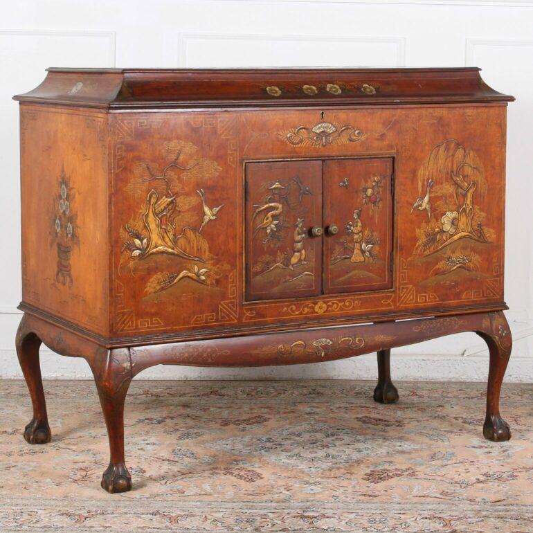 Vintage record & turntable cabinet by Wellington Gramophone Company featuring a Chinese motif with beautiful patina, resting on cabriole legs.  C. 1960