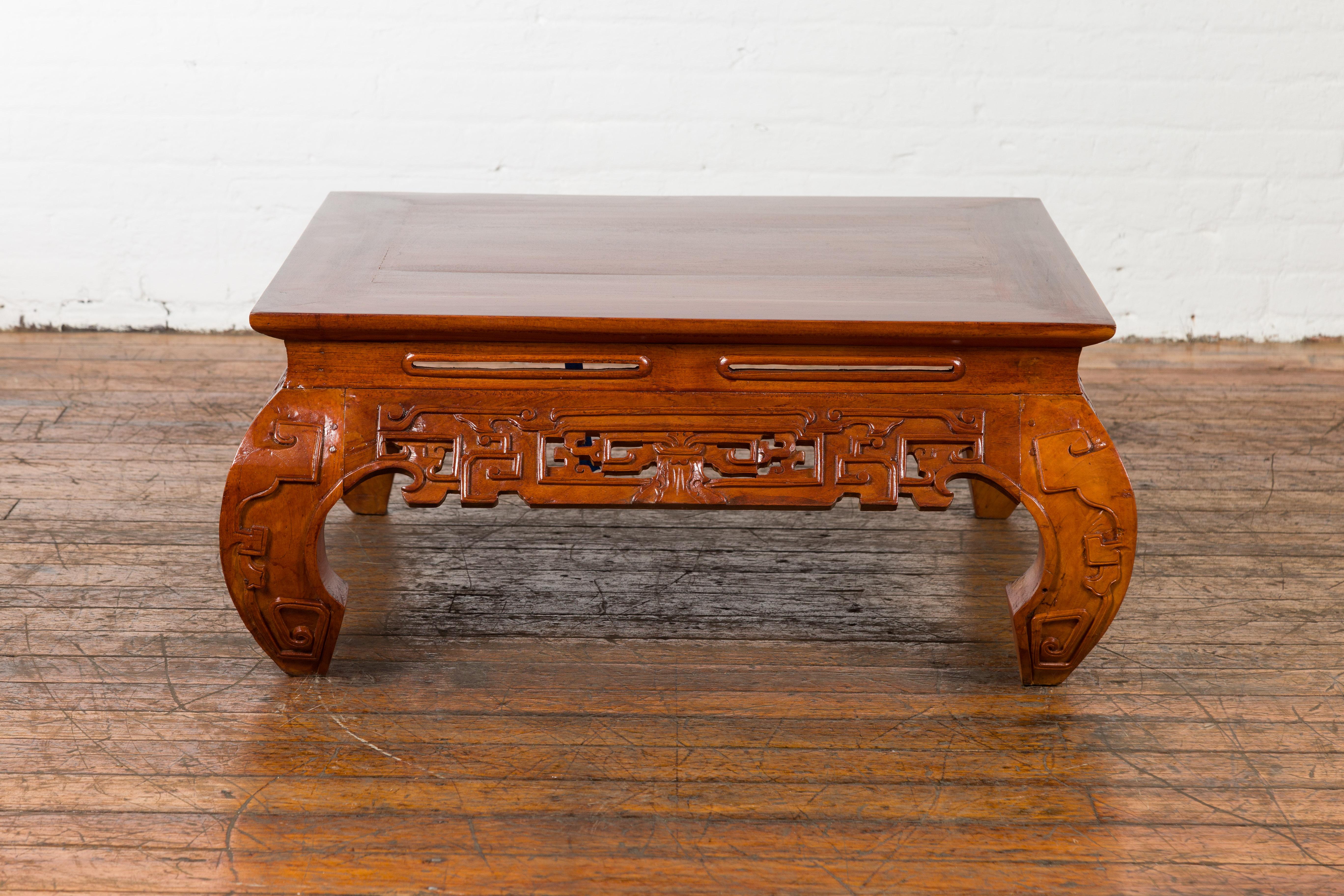 Javanese Vintage Chinese Style Low Kang Coffee Table with Carved Scrolls and Chow Legs For Sale