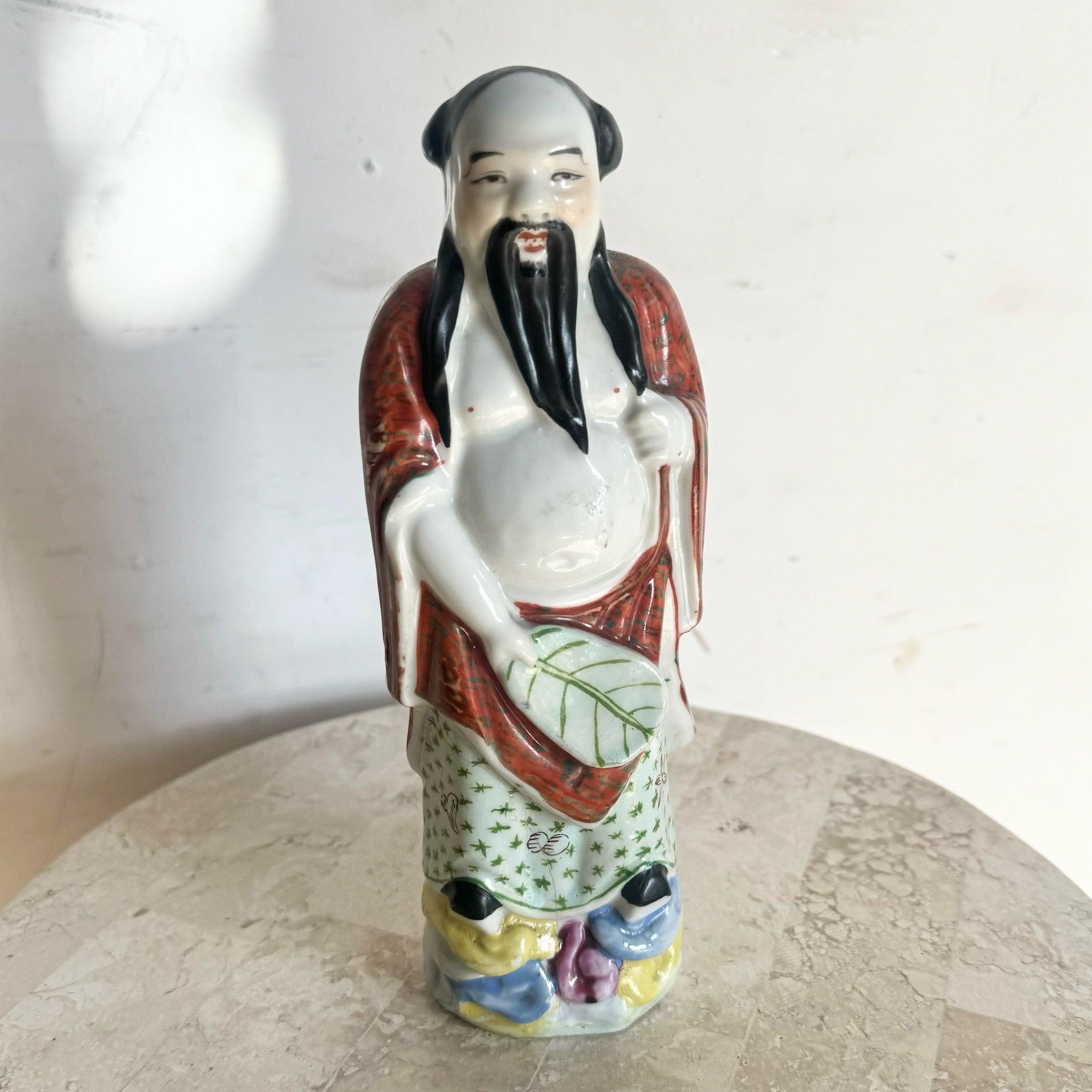 Vintage Chinese Taoist Porcelain Sculpture with hand-painted details, depicting a serene figure with flowing robes, ideal for collectors and decor enthusiasts.
 
 We sell items as acquired, without restoring or repairing. Vintage pieces may have