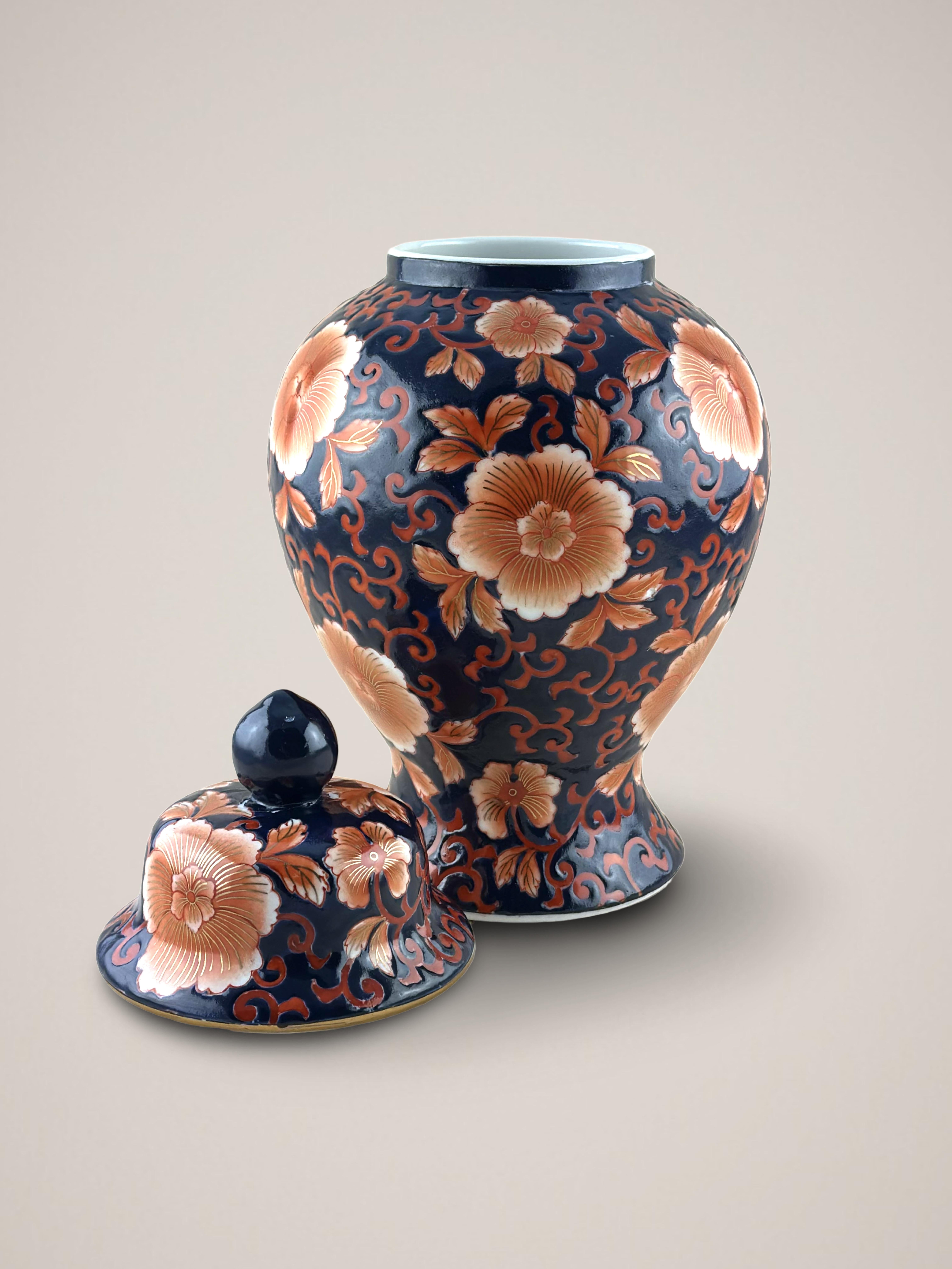 A large vintage Chinese temple jar, handcrafted in China during the 1980s.

Hand-decorated and enameled with an Imari-style design, inspired by Qianlong-era porcelain. The jar's body is finely embellished and hand-painted with a sea of underglaze