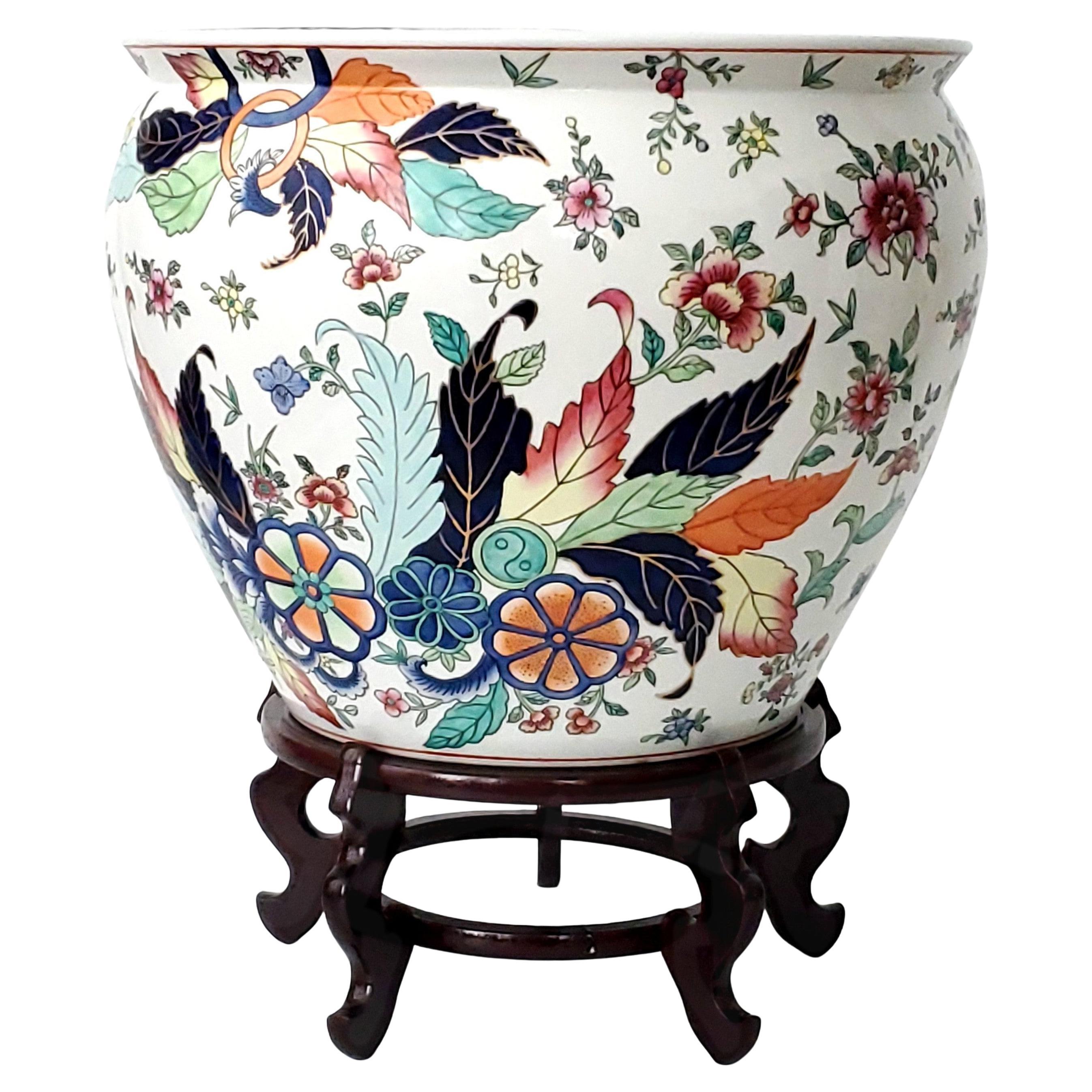 Vintage Chinese porcelain tobacco leaf planter, circa Mid 20th Century. This gorgeous hand painted planter came out of a Naples, FL estate and we were told it was never used. It is nearly flawless.
 
This colorful planter is loaded with an array of