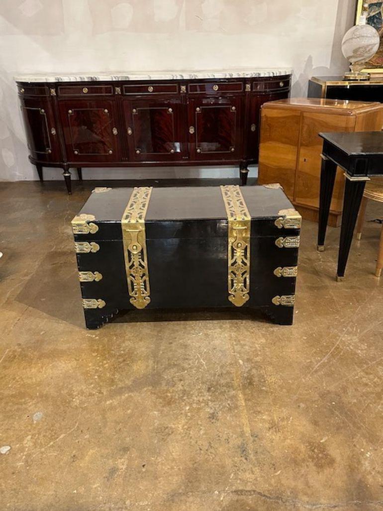 Vintage Chinse ebonized and polished brass trunk. Circa 1970. A timeless and classic touch for a fine interior.