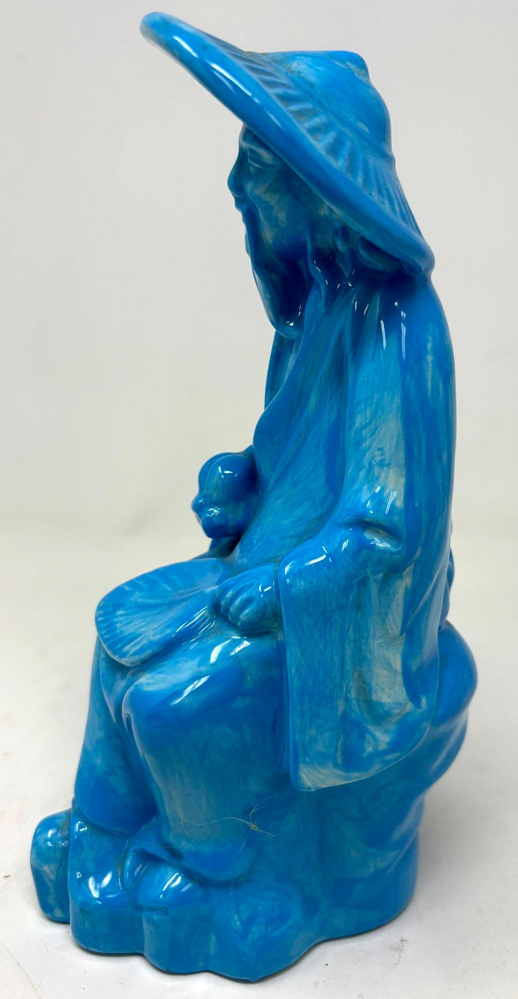 Vintage Arnel’s old Chinese man blue turquoise ceramic figurine.
Chinese blue turquoise glazed porcelain ceramic pottery of an Asian old man sitting figure.
Vintage Chinese blue glazed porcelain, mid 20th Century.
