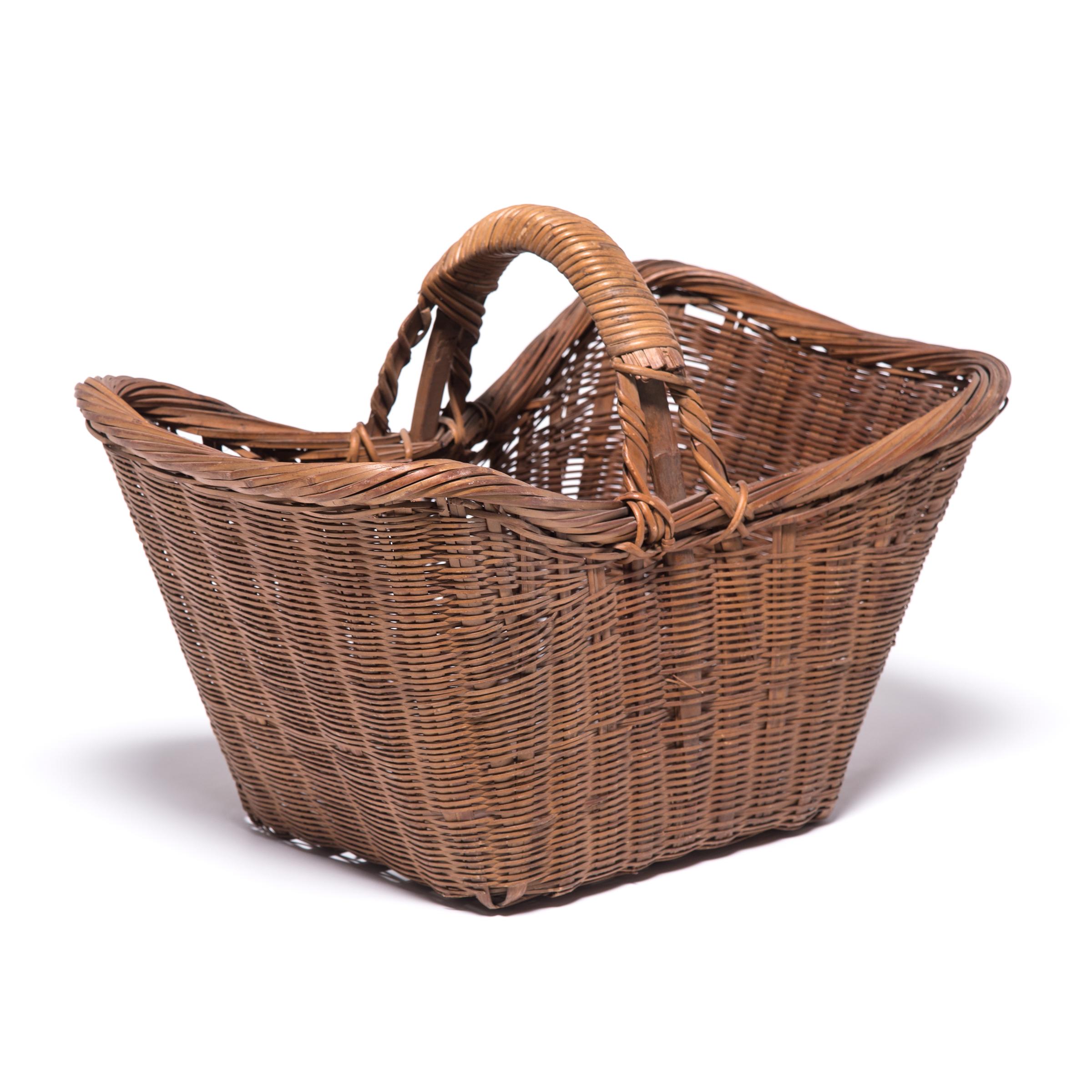 It's easy to imagine someone, long ago, walking to market on a beautiful summer day with this beautiful basket slung over their arm. Basket making is an ancient and humble Craft, but in the hands of a truly skilled weaver willow branches, like