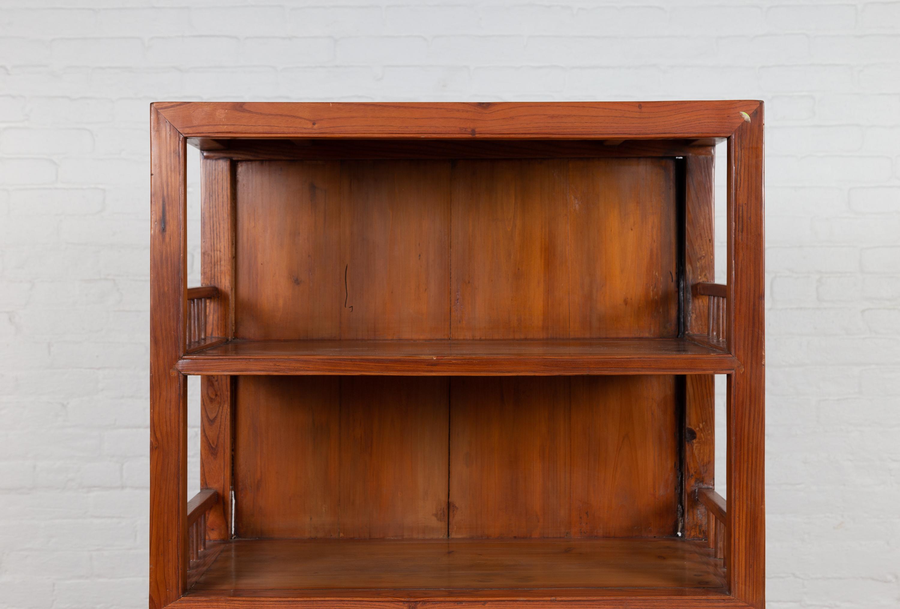 Vintage Chinese Two-Part Elmwood Bookcase with Pillar-Shaped Strut Motifs In Good Condition In Yonkers, NY