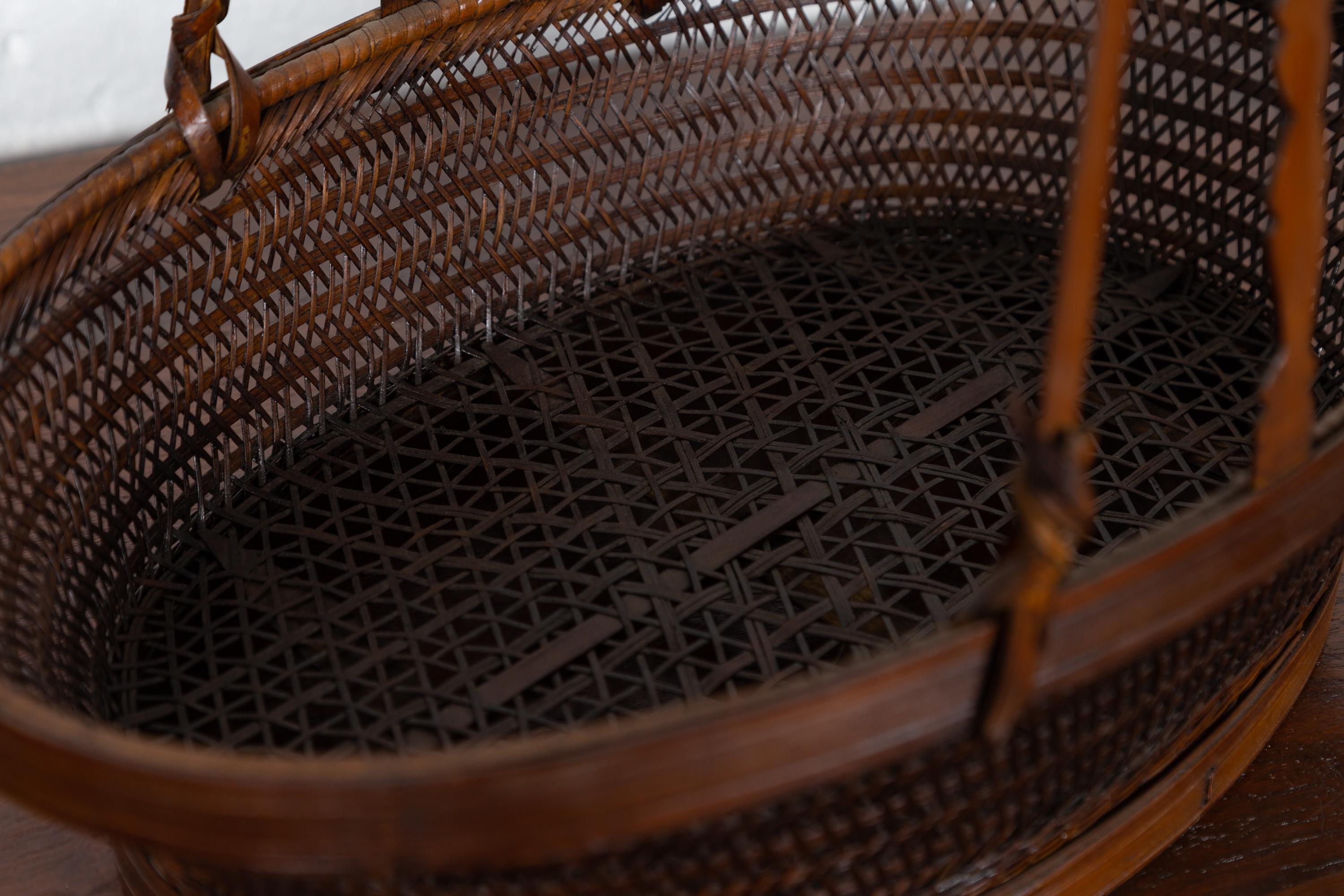 Vintage Chinese Woven Rattan Carrying Basket with Large Tripartite Handle In Good Condition For Sale In Yonkers, NY