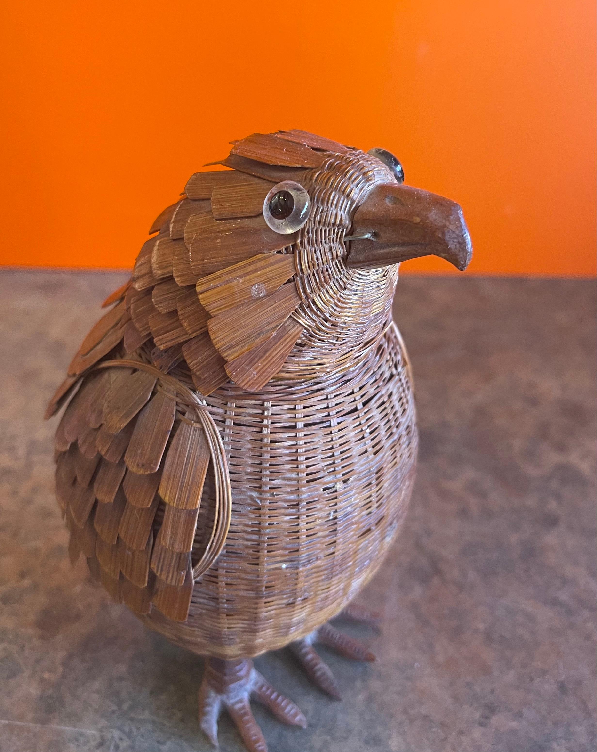 A very rare Chinese woven wicker bird box with removable lid (head) and glass eyes, circa 1940s. The detail and hand made craftsmanship of the piece is absolutely amazing. The piece is in very good vintage condition and measures 4