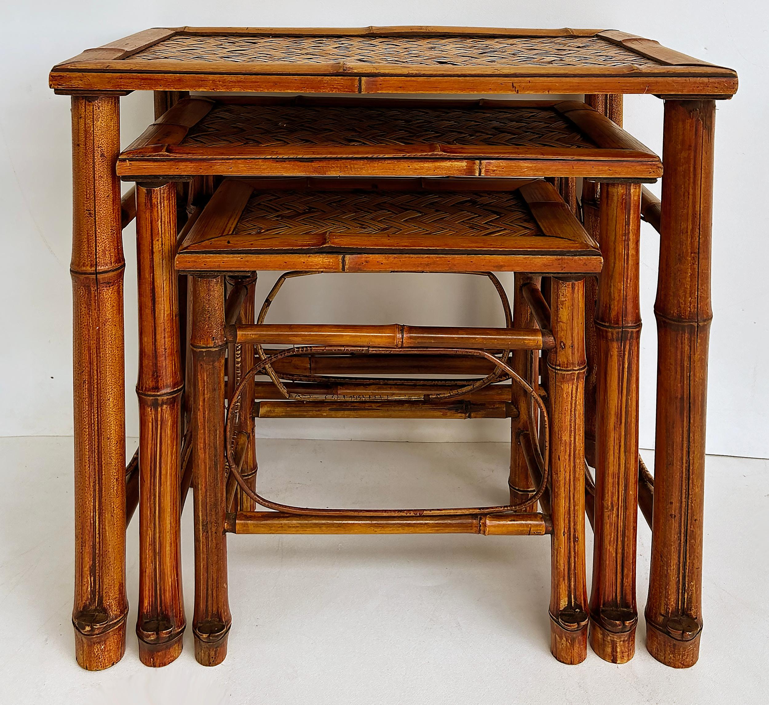 Vintage Chinoiserie Bamboo, Cane Nesting Stacking Tables, Set of 3

Offered for sale is a set of three (3) bamboo, cane and rattan nesting tables.  These lovely tables are hand-crafted and in very good vintage condition.  

The dimensions for the