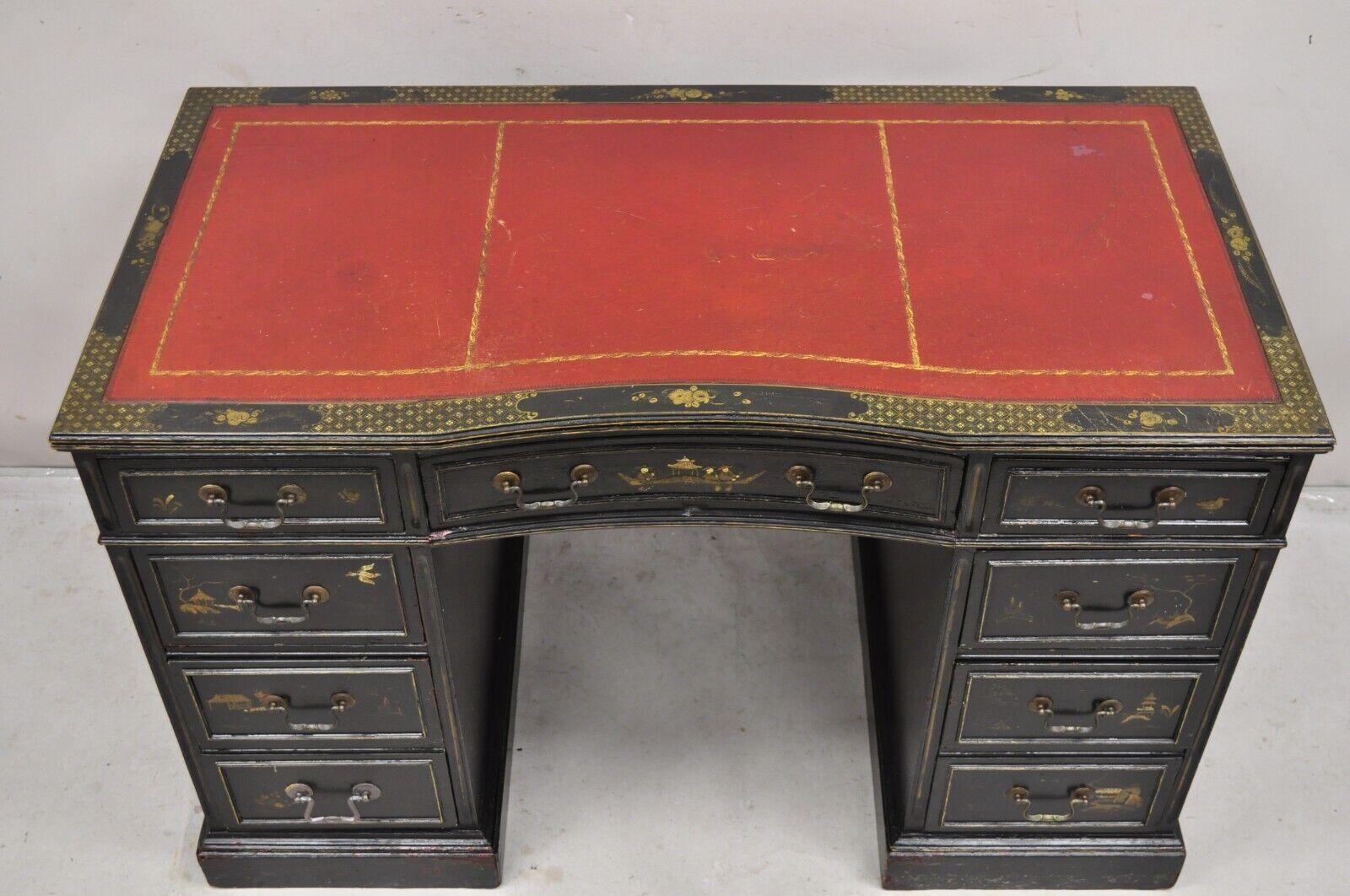 Vintage Chinoiserie Black Chinese Painted Red Leather Top Kneehole Writing Desk. item features 7 drawers, red tooled leather top, hand painted scenes and details on all sides including the finished back, very unique vintage desk. Circa Early 20th