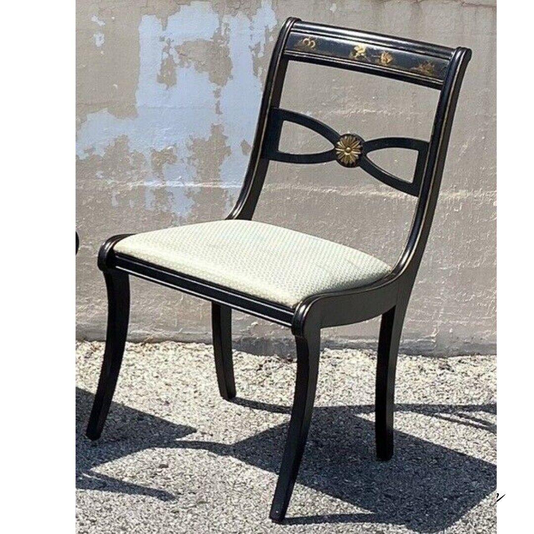 Vintage Chinoiserie Black Painted Asian Regency Style Dining Chairs - Set of 4. Possibly by Drexel. (4) side chairs, black painted finish, painted scenes to backrests, shapely saber legs, very nice set to refurbish. Circa Mid 20th Century.