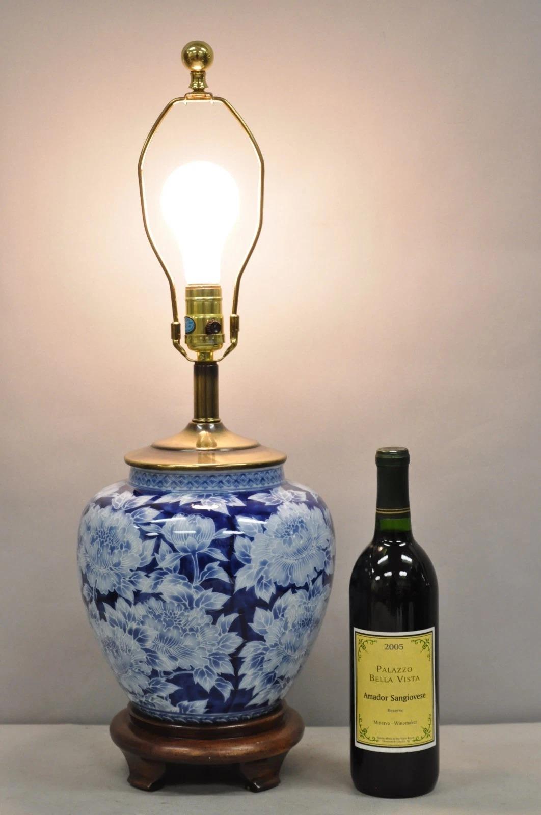 Vintage Chinoiserie Blue & White Porcelain Flower Painted Oriental Ginger Jar Vase Table Lamp. Circa Late 20th Century. Measurements: 25.5