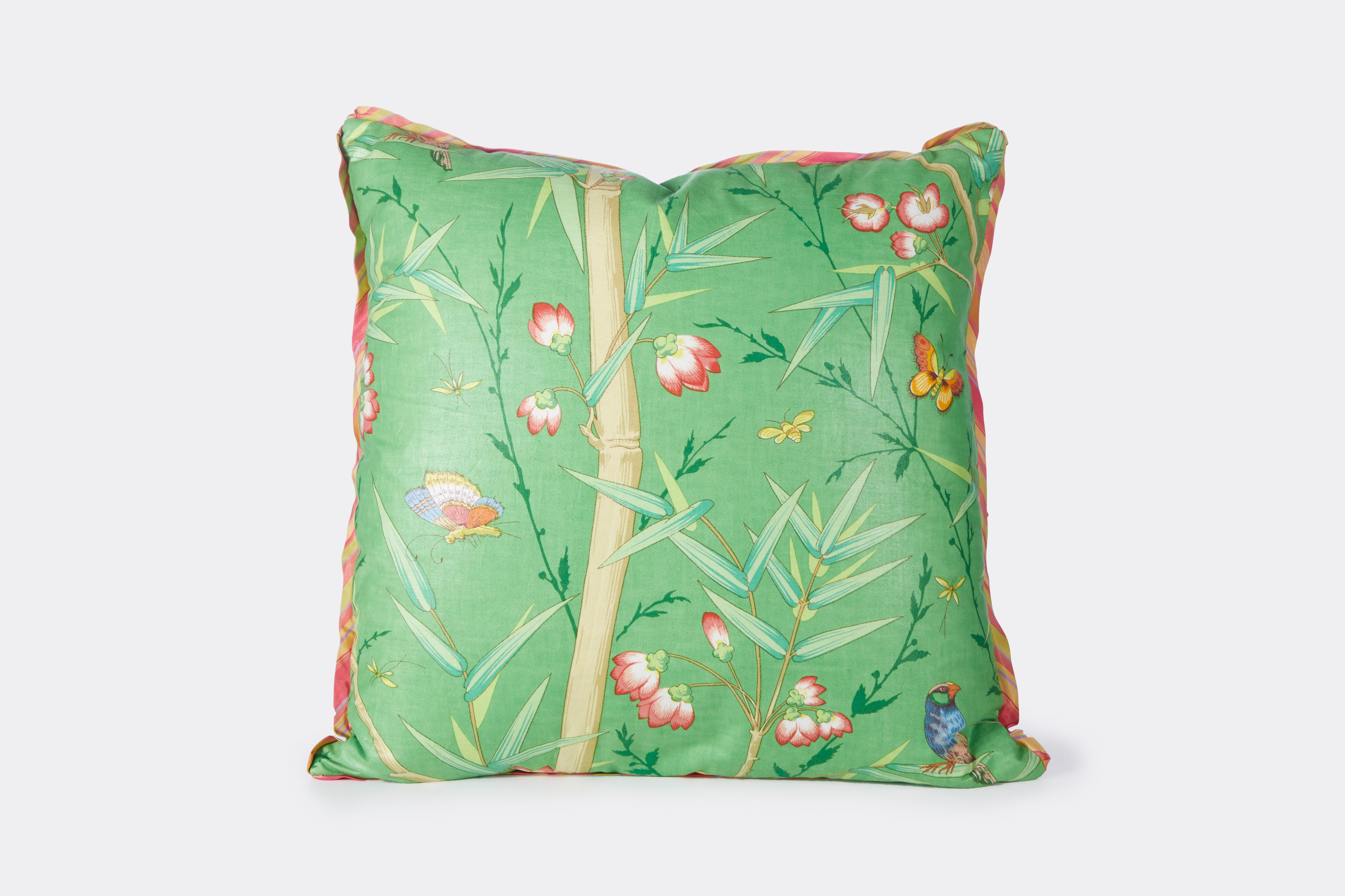 A new cushion made using vintage Schumacher Chinoiserie inspired chintz design with branches leaves and birds. Trimmed with bias silk stripe and backed with Rogers and Goffigon linen silk blend fabric.
