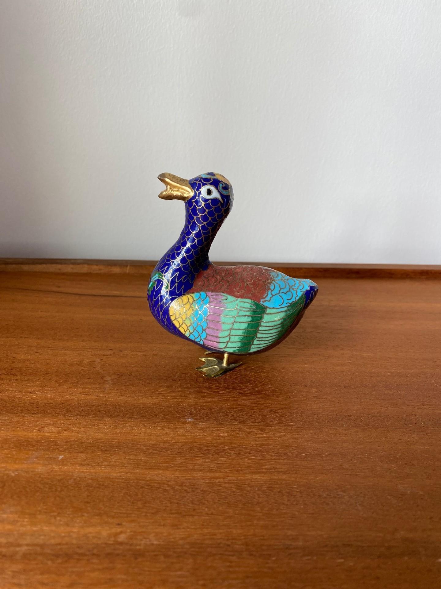 Beautiful vintage asian cloisonne duck figure.  This piece features pink, yellow, blue, green, red and brass hues.  Beautiful figure that will add excitement to any decor and any collector.

Mid-Century, Hollywood Regency, Art Deco, Eclectic,