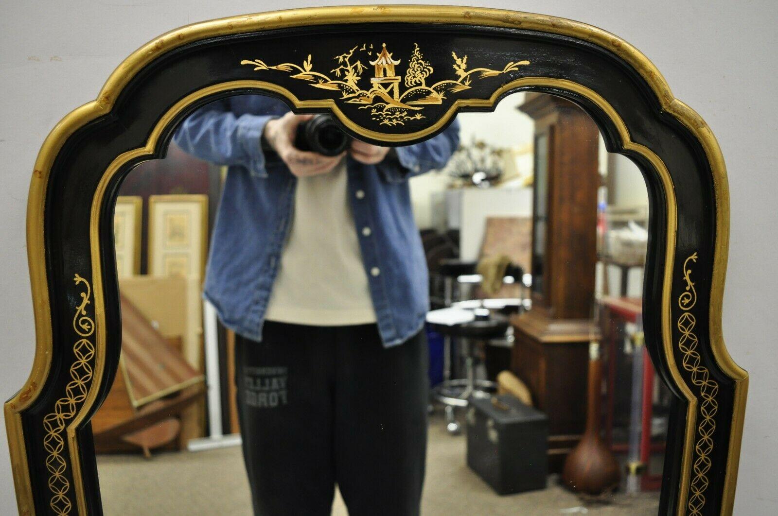 black and gold arched mirror