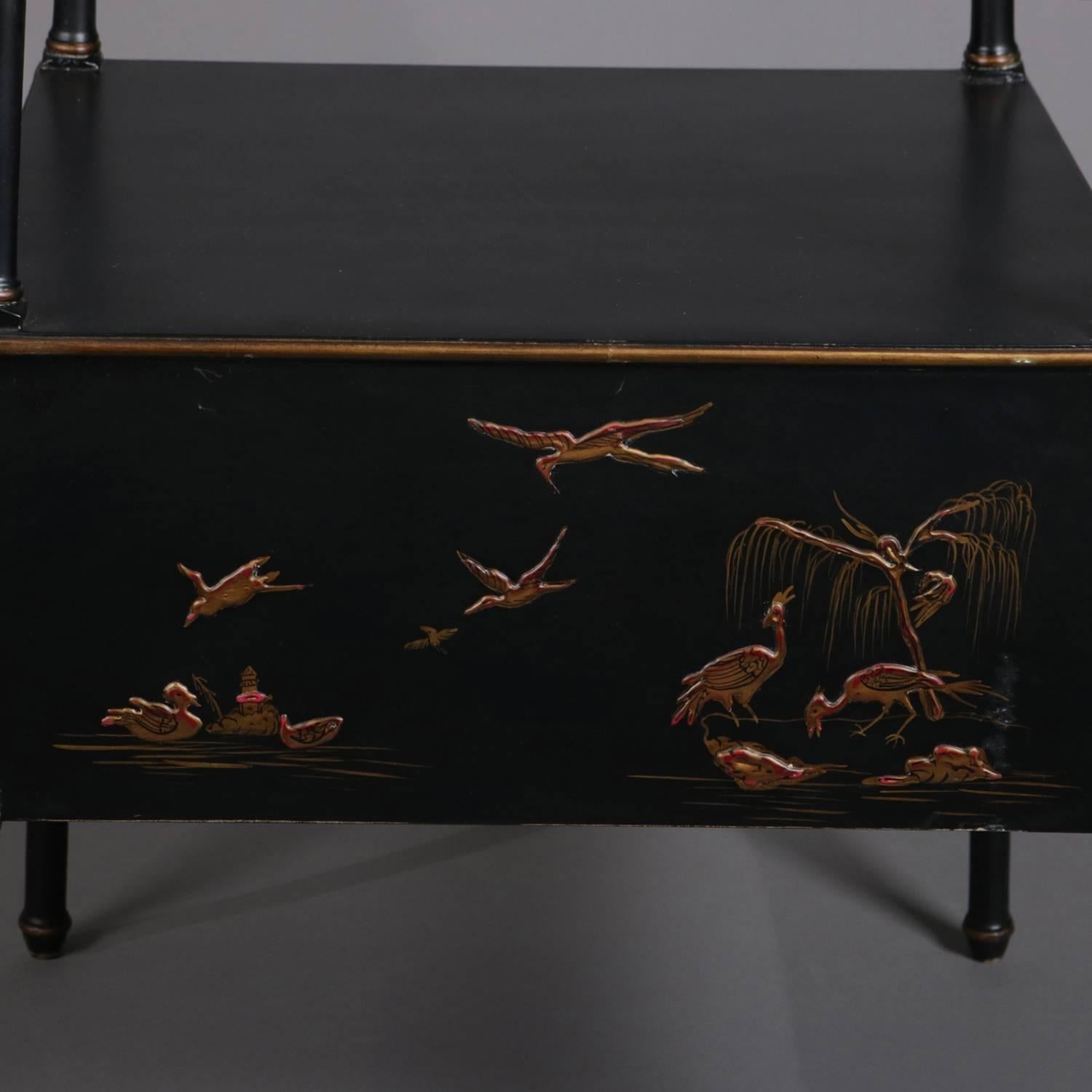 Vintage chinoiserie four-tier display stand features graduated displays, ebonized finish with gilt decorated apron depicting villager and marsh scene with birds, gilt checkering and banding throughout, 20th century

Measures: 69
