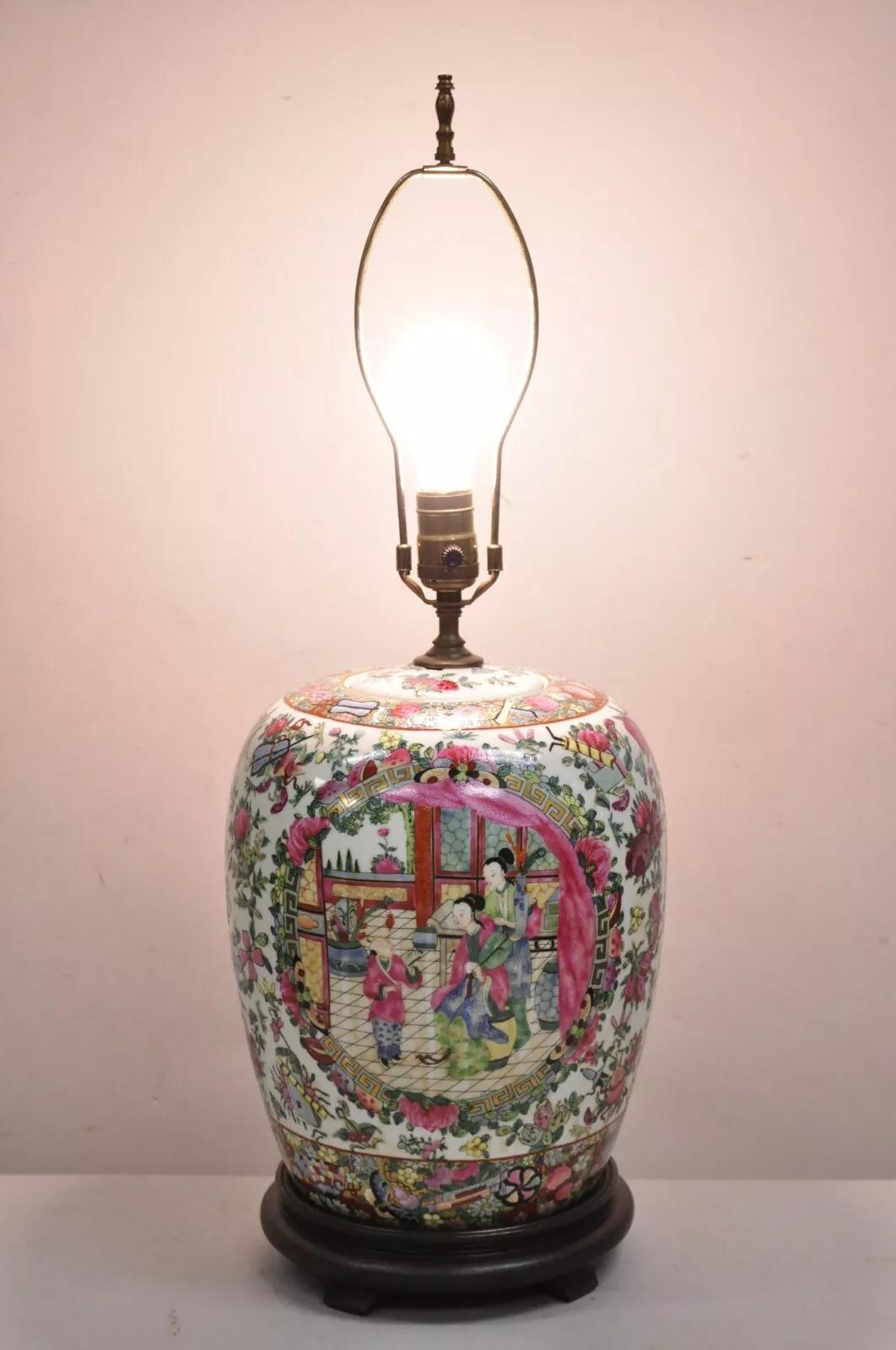Vintage Chinoiserie Famille Rose Chinese Porcelain Asian Ginger Jar Table Lamp on Wooden Base, Decorated on all Sides. Circa Late 20th Century. Measurements: 27